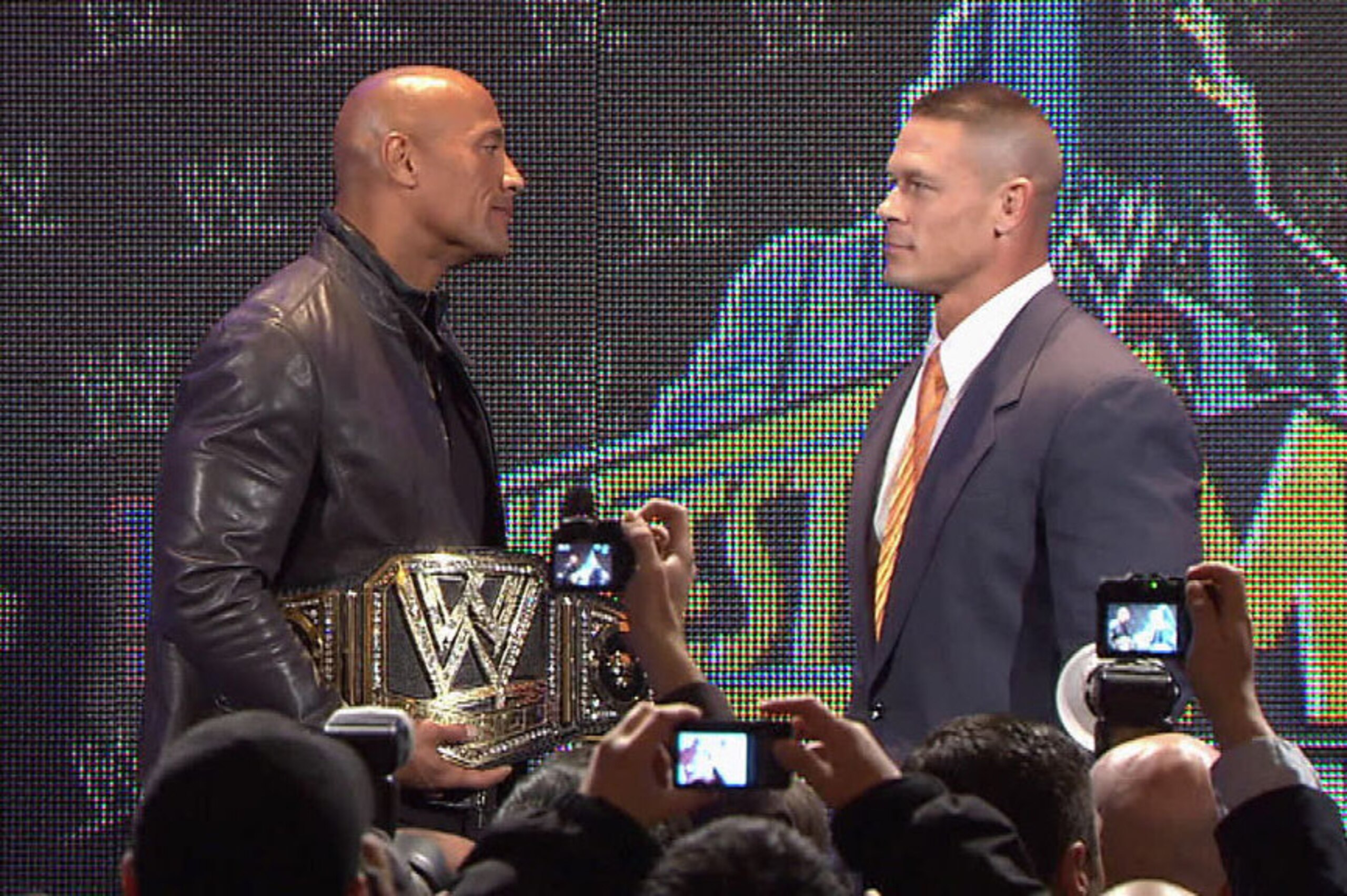The Rock and John Cena stare each other down at last year's press conference.