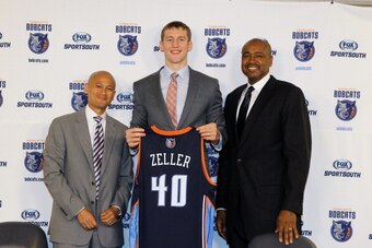 CHARLOTTE, NC - JUNE 28:  (L-R) Rich Cho, Cody Zeller and Rod Higgins of the Charlotte Bobcats pose for a photo during a press conference introducing Cody Zeller to the media at the Time Warner Cable Arena on June 28, 2013 in Charlotte, North Carolina.  N