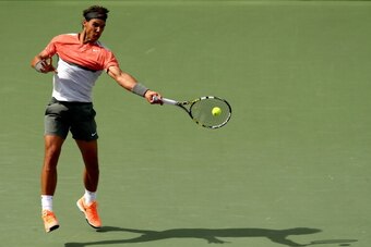 KEY BISCAYNE, FL - MARCH 30:  Rafael Nadal of Spain returns a shot to Novak Djokovic of Serbia during the final of the Sony Open at the Crandon Park Tennis Center on March 30, 2014 in Key Biscayne, Florida.  (Photo by Matthew Stockman/Getty Images)