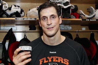 PHILADELPHIA, PA - MARCH 30: Vincent Lecavalier #40 of the Philadelphia Flyers poses with his 400th NHL goal puck after his game against the Boston Bruins on March 30, 2014 at the Wells Fargo Center in Philadelphia, Pennsylvania. The Bruins went on to def