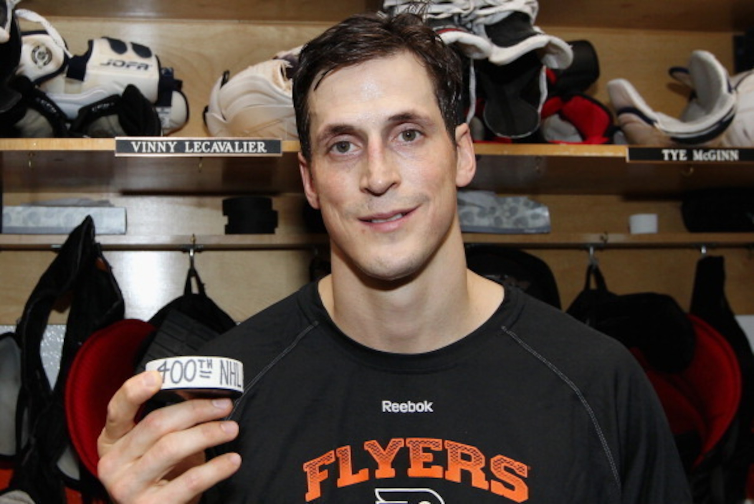 PHILADELPHIA, PA - MARCH 30: Vincent Lecavalier #40 of the Philadelphia Flyers poses with his 400th NHL goal puck after his game against the Boston Bruins on March 30, 2014 at the Wells Fargo Center in Philadelphia, Pennsylvania. The Bruins went on to def