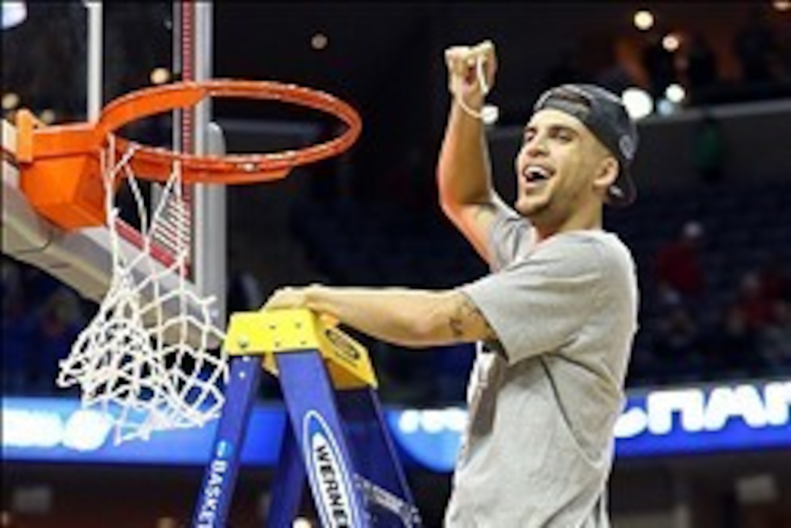 Mar 29, 2014; Memphis, TN, USA; Florida Gators guard Scottie Wilbekin (5) cuts the net after defeating the Dayton Flyers in the finals of the south regional of the 2014 NCAA Mens Basketball Championship tournament at FedEx Forum. Florida won 62-52. Mandat