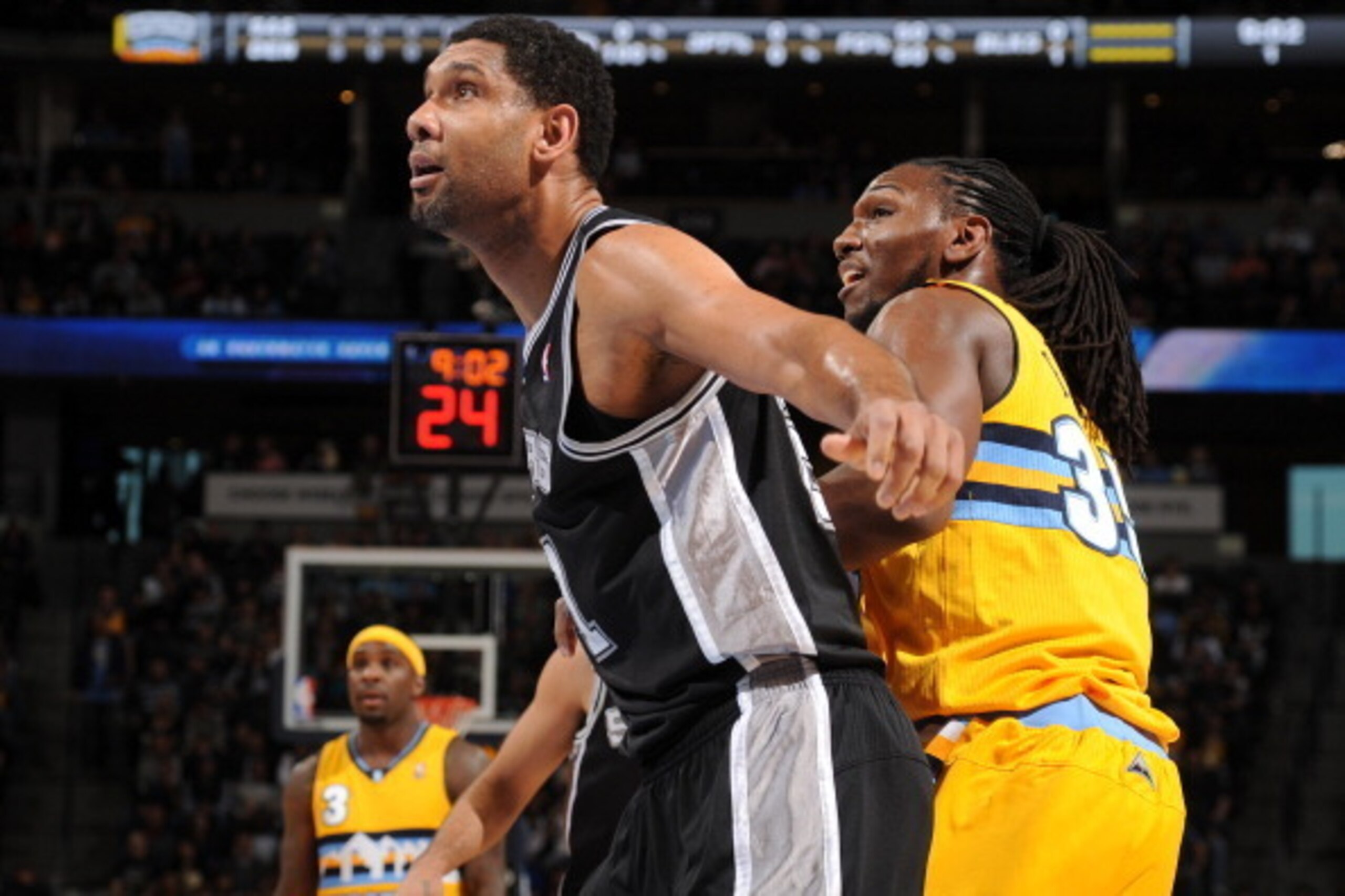 DENVER, CO - March 28: Tim Duncan #21 of the San Antonio Spurs during a game against the Denver Nuggets on March 28, 2014 at the Pepsi Center in Denver, Colorado. NOTE TO USER: User expressly acknowledges and agrees that, by downloading and/or using this 