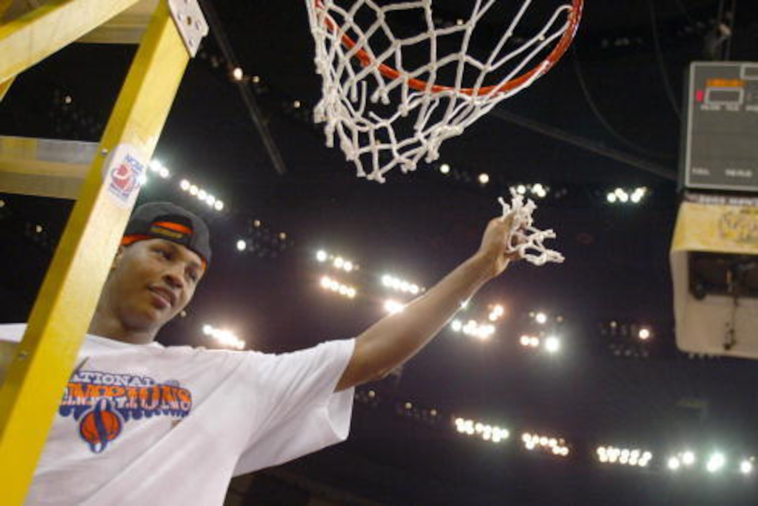 NEW ORLEANS - APRIL 7:  Carmelo Anthony #15 of Syracuse cuts down the net after he and his team defeated Kansas 81-78 during the championship game of the NCAA Men's Final Four Tournament on April 7, 2003 at the Louisiana Superdome in New Orleans, Louisian