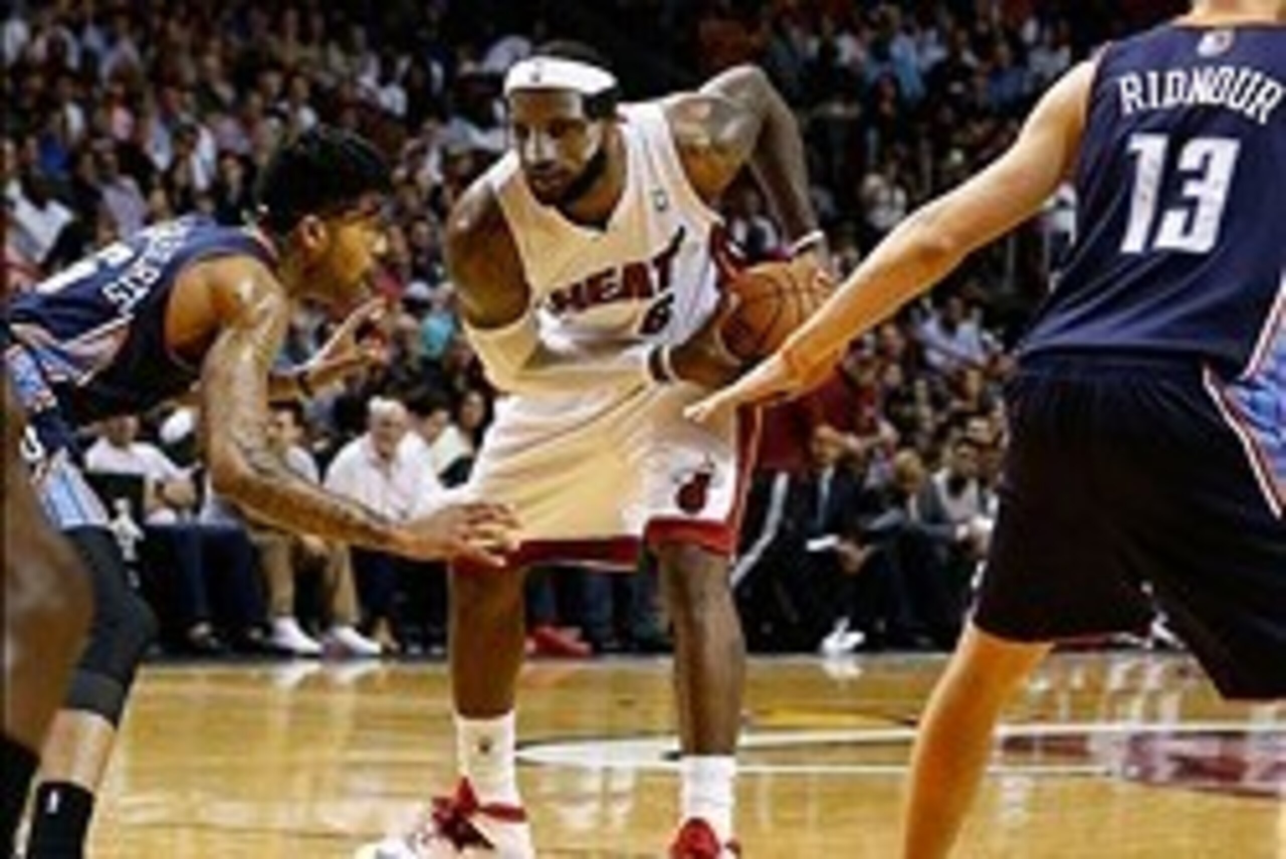 Mar 3, 2014; Miami, FL, USA; Miami Heat small forward LeBron James (6) is defended by Charlotte Bobcats shooting guard Chris Douglas-Roberts (55) and point guard Luke Ridnour (13) in the second half at American Airlines Arena. Mandatory Credit: Robert Ma Mar 3, 2014; Miami, FL, USA; Miami Heat small forward LeBron James (6) is defended by Charlotte Bobcats shooting guard Chris Douglas-Roberts (55) and point guard Luke Ridnour (13) in the second half at American Airlines Arena. Mandatory Credit: Robert Ma