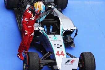 KUALA LUMPUR, MALAYSIA - MARCH 30:  Fernando Alonso of Spain and Ferrari inspects the car of race winner Lewis Hamilton of Great Britain and Mercedes GP in parc ferme after the Malaysia Formula One Grand Prix at the Sepang Circuit on March 30, 2014 in Kua