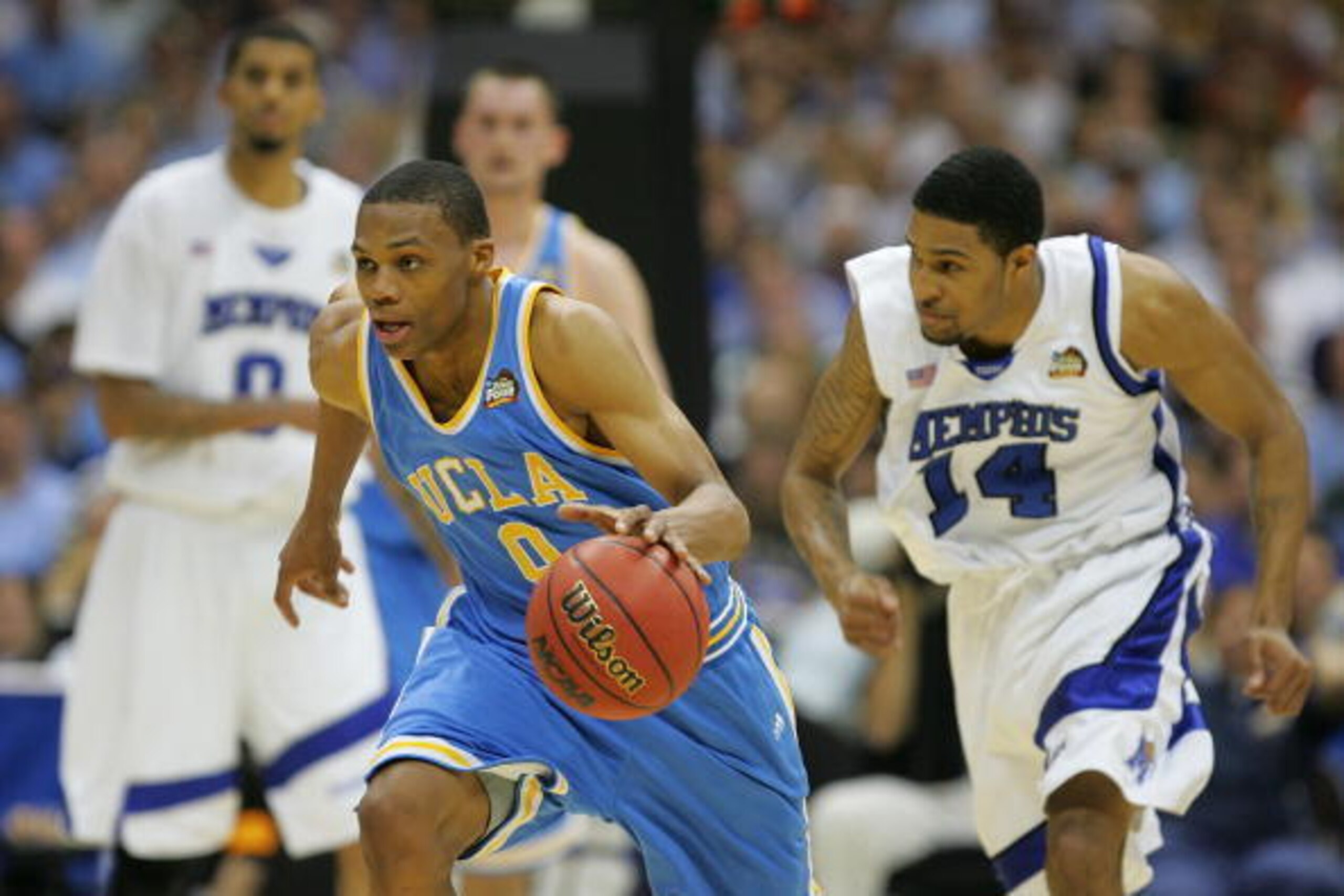 SAN ANTONIO - APRIL 05:  Russell Westbrook #0 of the UCLA Bruins dribbles up court after making a steal against the Memphis Tigers in the first half during the National Semifinal game of the NCAA Men's Final Four at the Alamodome on April 5, 2008 in San A