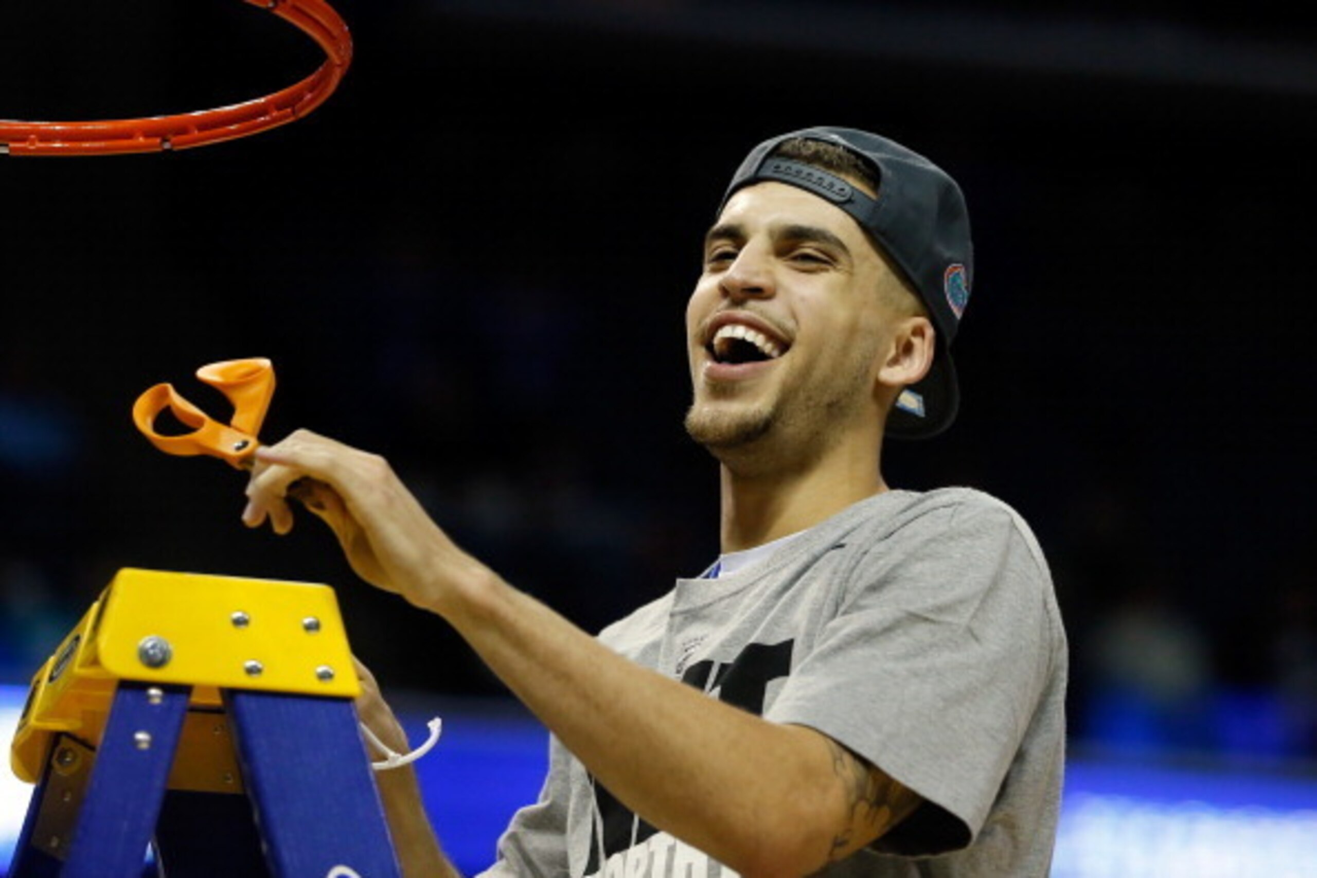 MEMPHIS, TN - MARCH 29:  Scottie Wilbekin #5 of the Florida Gators cuts the net after defeating the Dayton Flyers 62-52 in the south regional final of the 2014 NCAA Men's Basketball Tournament at the FedExForum on March 29, 2014 in Memphis, Tennessee.  (P