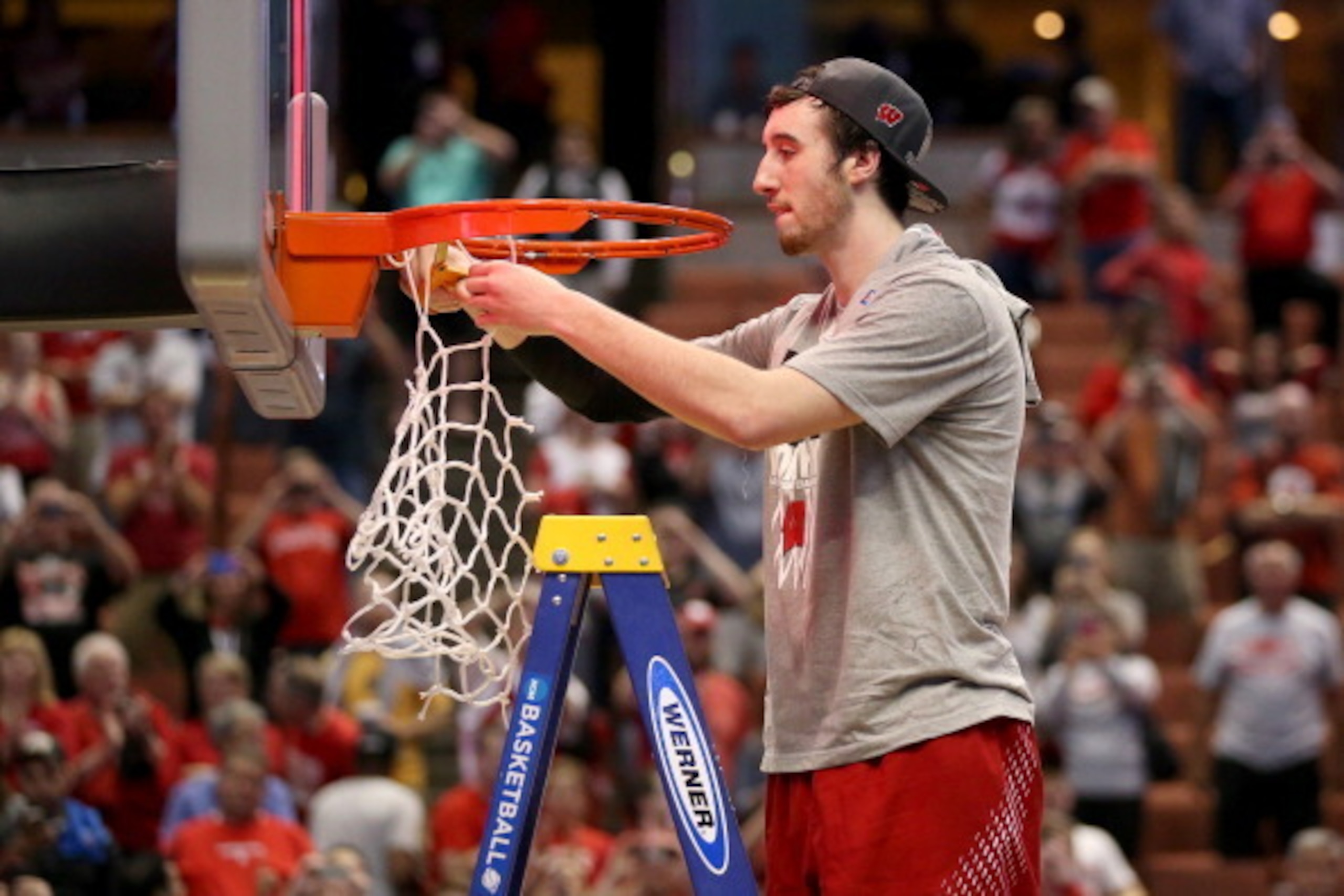 ANAHEIM, CA - MARCH 29:  Frank Kaminsky #44 of the Wisconsin Badgers cuts down the net after defeating the Arizona Wildcats 64-63 in overtime during the West Regional Final of the 2014 NCAA Men's Basketball Tournament at the Honda Center on March 29, 2014