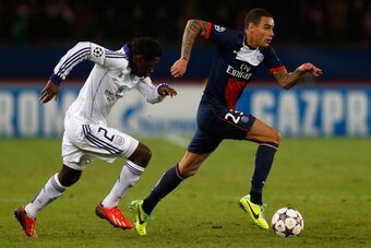 PARIS, FRANCE - NOVEMBER 05:  Gregory van der Wiel of PSG is chased by Fabrice N'Sakala of Anderlecht during the UEFA Champions League Group C match between Paris Saint Germain and RSC Anderlecht at Parc des Princes on November 5, 2013 in Paris, France.  