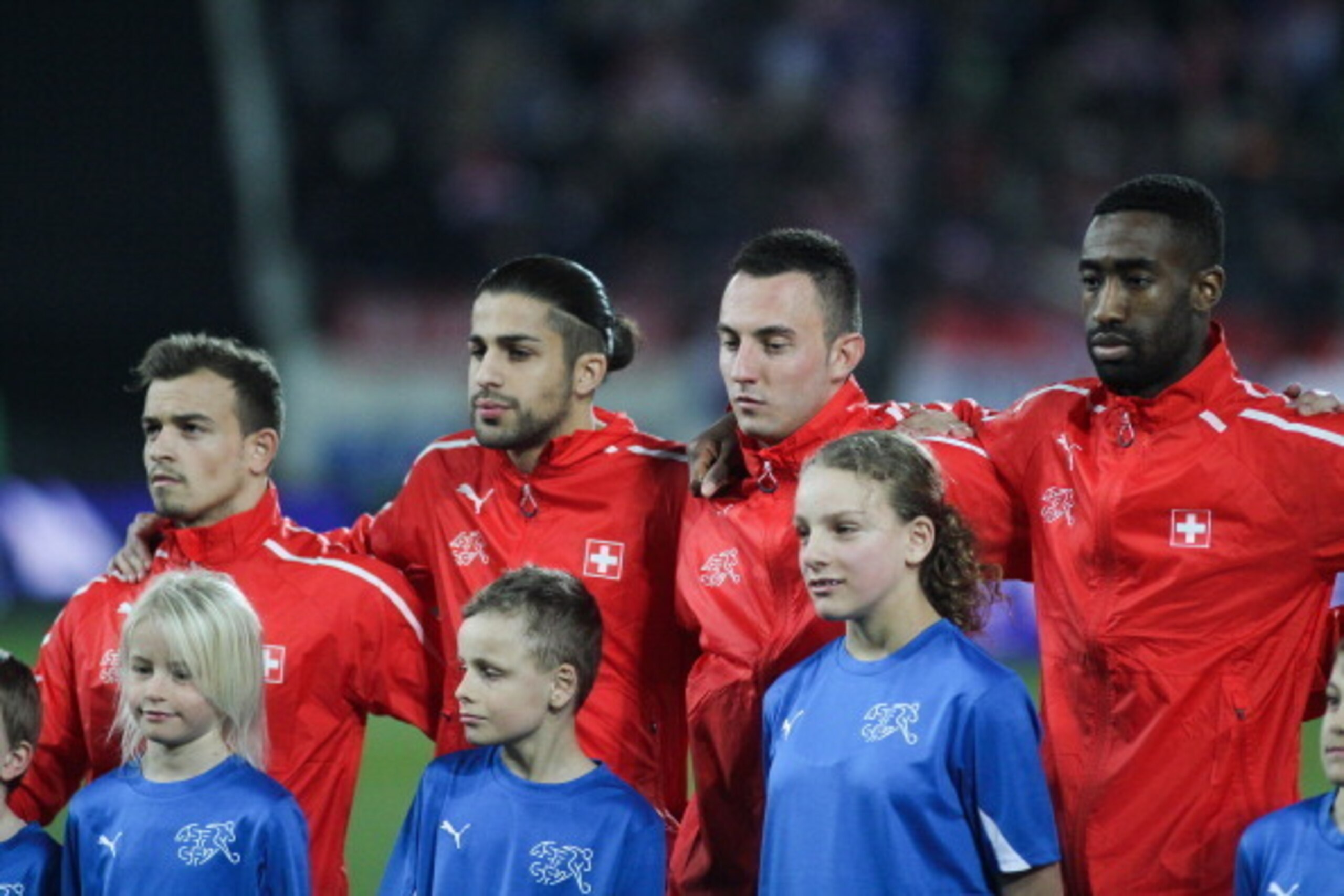 ST GALLEN, SWITZERLAND - MARCH 05: (L-R) Xherdan Shaqiri, Ricardo Rodriguez, Josip Drmic and Johan Djourou of Switzerland stand for the national anthem prior the international friendly match between Switzerland and Croatia at the AFG Arena on March 5, 201