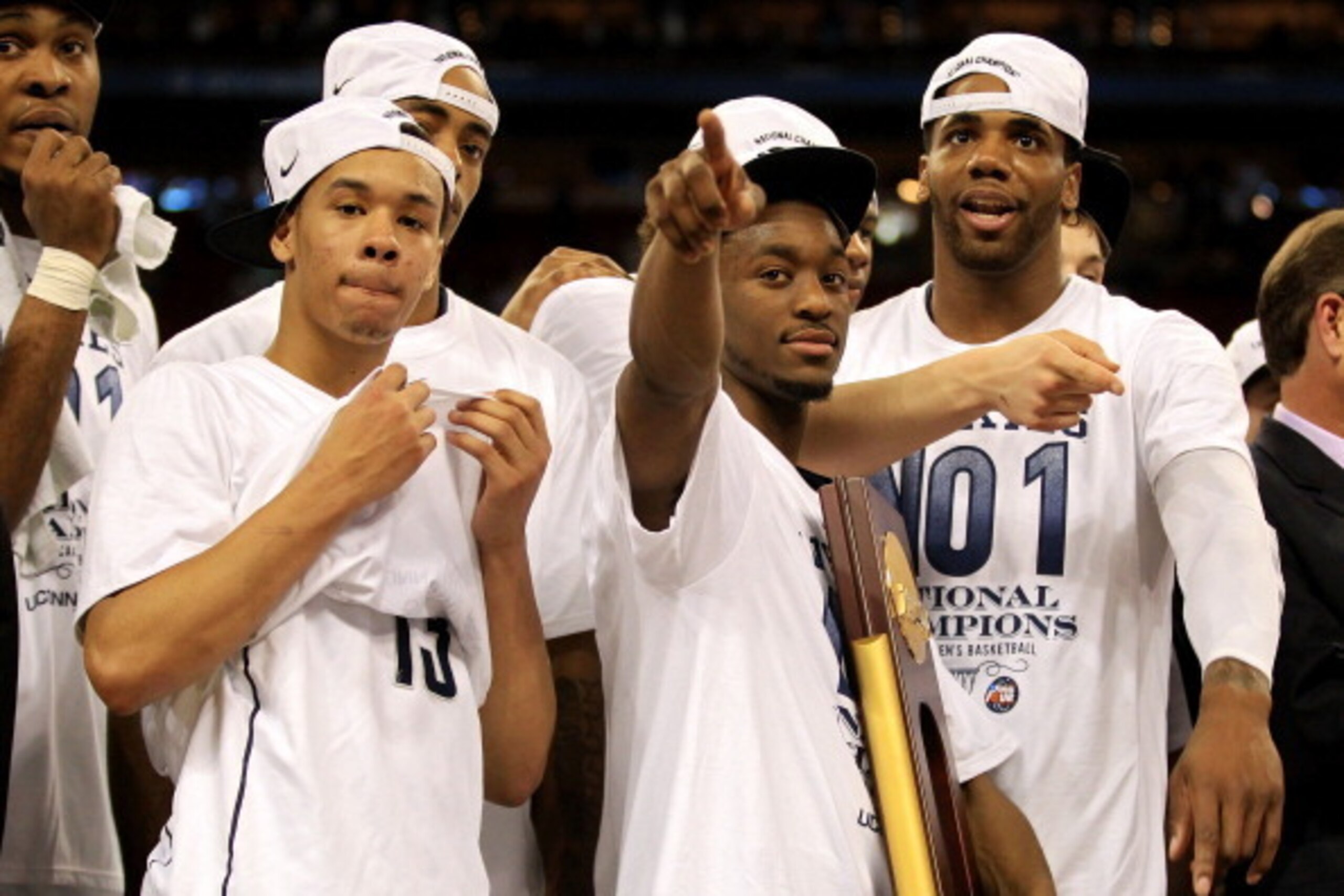 HOUSTON, TX - APRIL 04: Kemba Walker #15, Shabazz Napier #13 and Alex Oriakhi #34 of the Connecticut Huskies celebrate with the trophy after defeating the Butler Bulldogs to win the National Championship Game of the 2011 NCAA Division I Men's Basketball HOUSTON, TX - APRIL 04: Kemba Walker #15, Shabazz Napier #13 and Alex Oriakhi #34 of the Connecticut Huskies celebrate with the trophy after defeating the Butler Bulldogs to win the National Championship Game of the 2011 NCAA Division I Men's Basketball