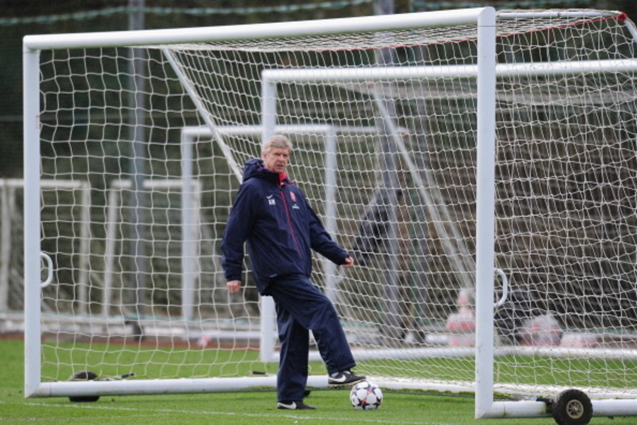 ST ALBANS, ENGLAND - FEBRUARY 18:  Arsenal manager Arsene Wenger during a training session at London Colney on February 18, 2014 in St Albans, England.  (Photo by Shaun Botterill/Getty Images)