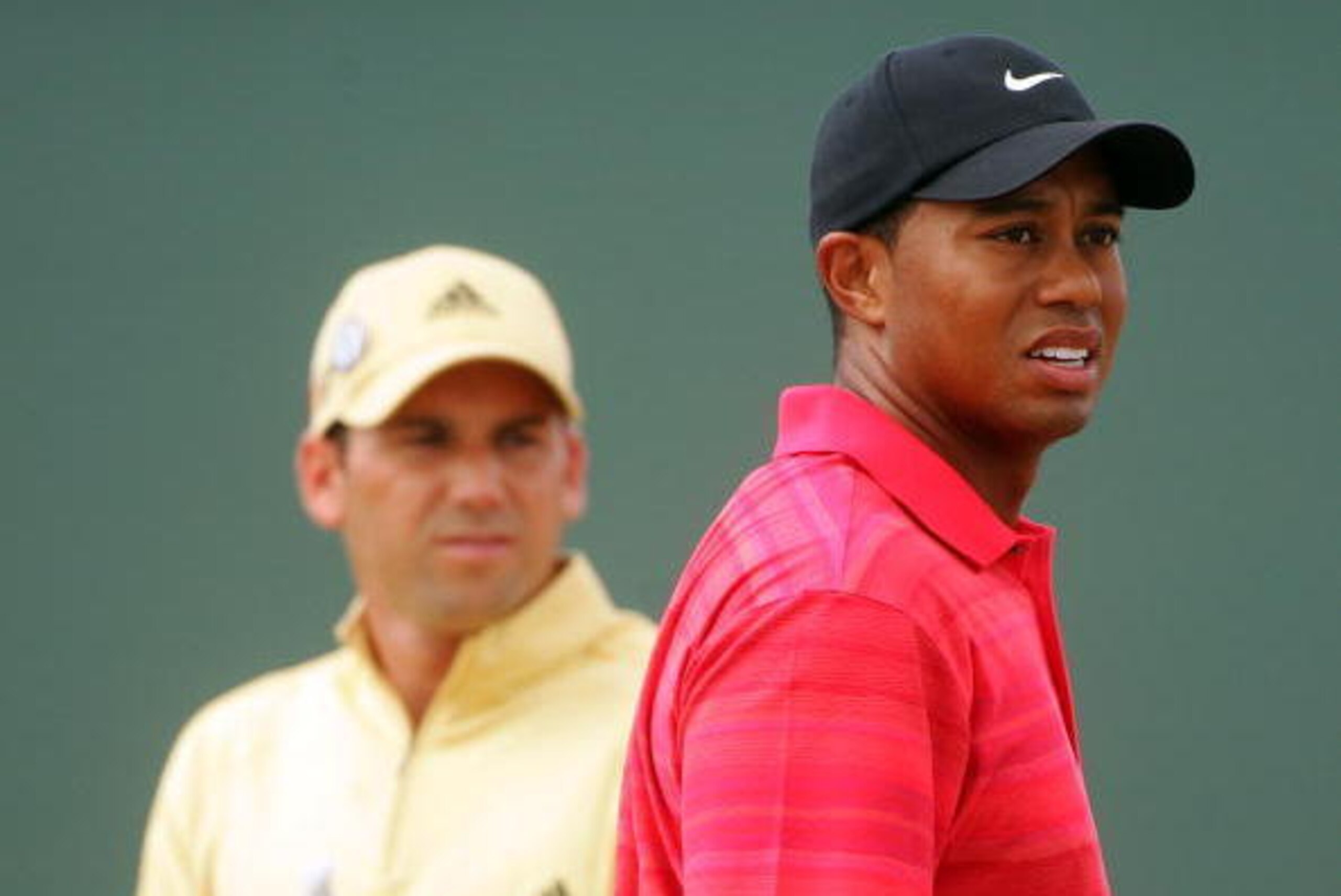 HOYLAKE, UNITED KINGDOM - JULY 23: Tiger Woods of USA watches his tee shot on the 4th hole, as Sergio Garcia of Spain looks on during the final round of The Open Championship at Royal Liverpool Golf Club on July 23, 2006 in Hoylake, England.  (Photo by An