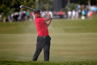 DORAL, FL - MARCH 09:  Tiger Woods plays a bunker shot on the fifth hole during the final round of the World Golf Championships-Cadillac Championship at Trump National Doral on March 9, 2014 in Doral, Florida.  (Photo by Chris Trotman/Getty Images)