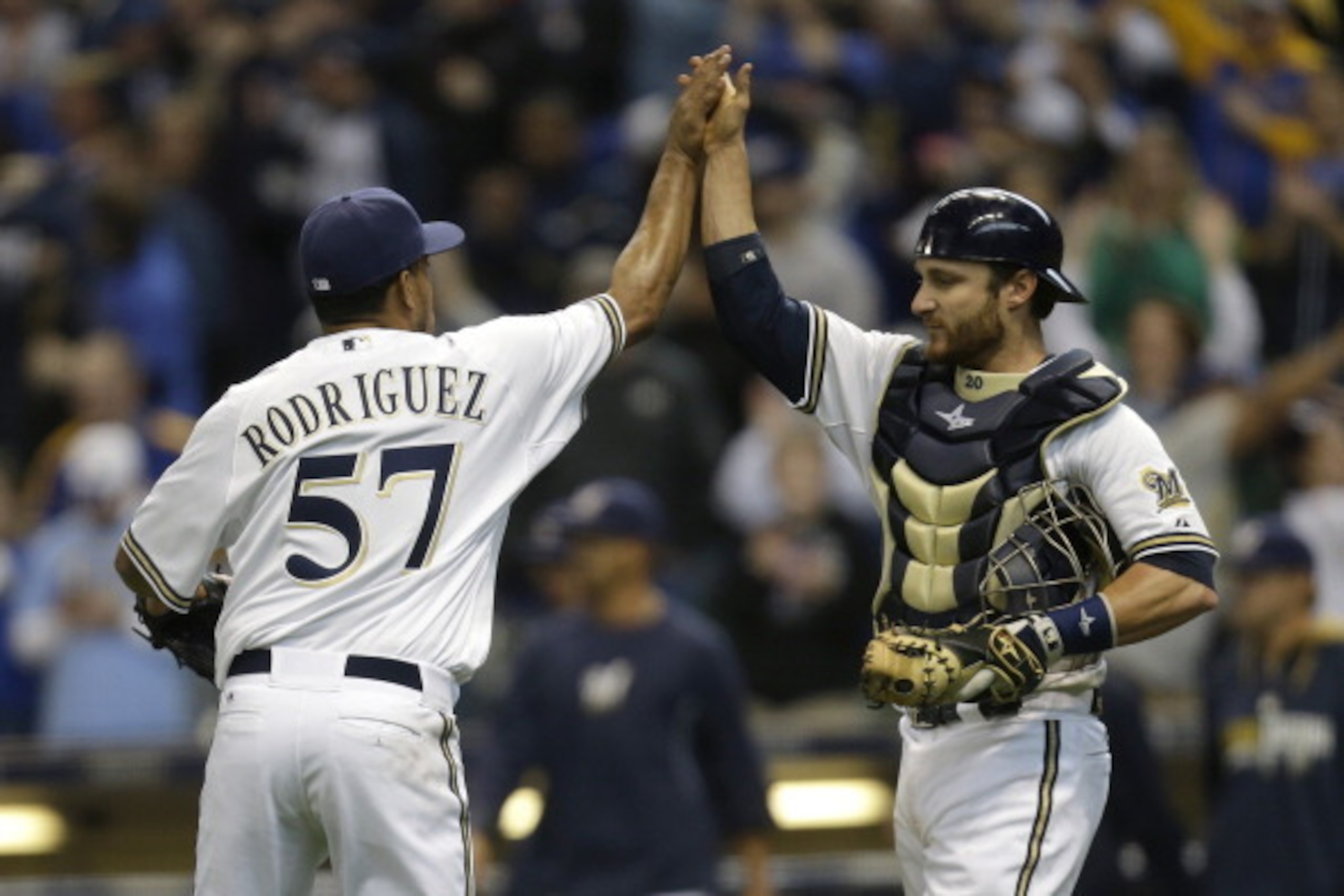 MILWAUKEE, WI - MARCH 31: Francisco Rodriguez #57 of the Milwaukee Brewers and Jonathan Lucroy #20 celebrates after the 2-0 win over the Atlanta Braves during Opening Day at Miller Park on March 31, 2014 in Milwaukee, Wisconsin. (Photo by Mike McGinnis/Ge