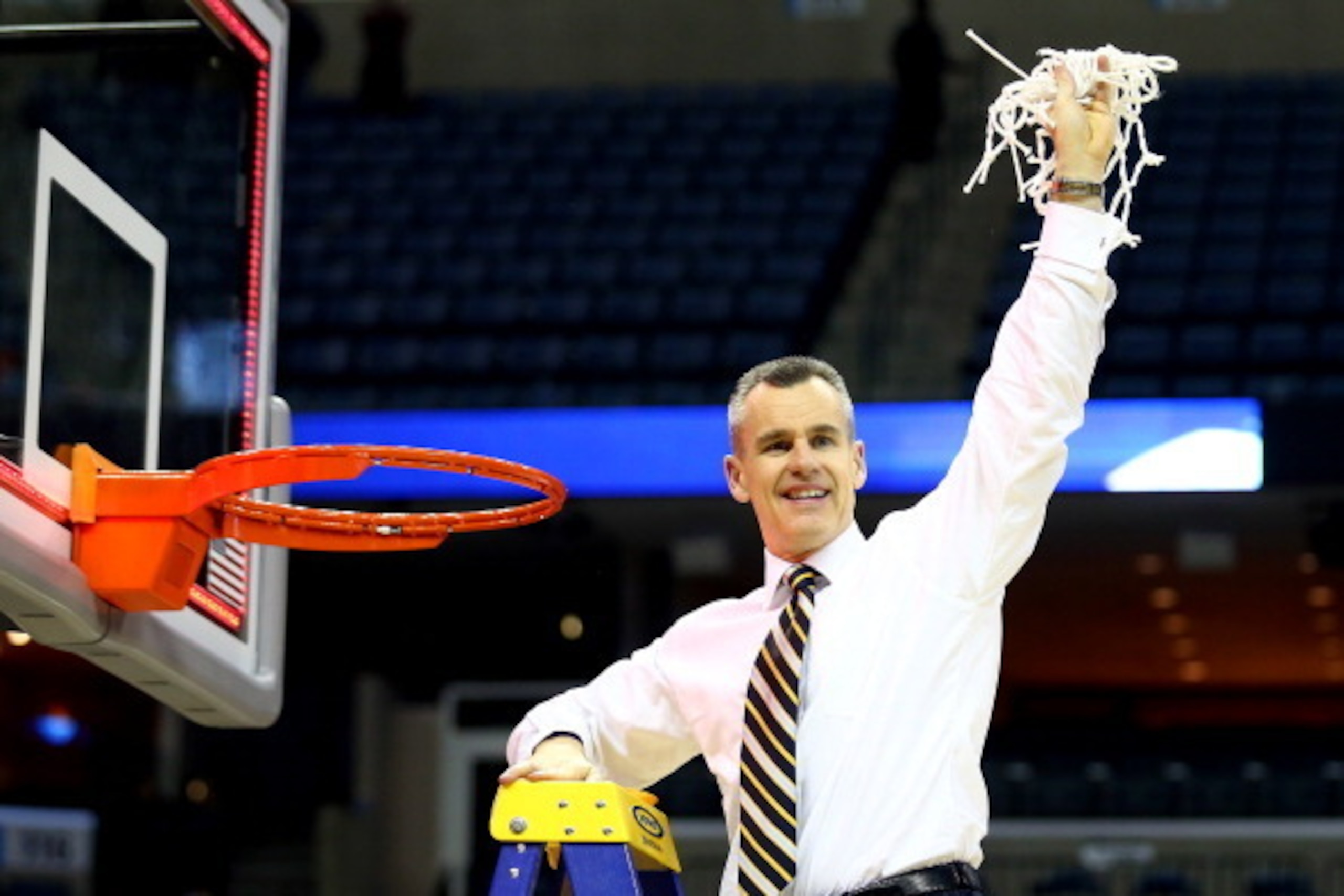 MEMPHIS, TN - MARCH 29:  Head coach Billy Donovan of the Florida Gators cuts the net after defeating the Dayton Flyers 62-52 in the south regional final of the 2014 NCAA Men's Basketball Tournament at the FedExForum on March 29, 2014 in Memphis, Tennessee