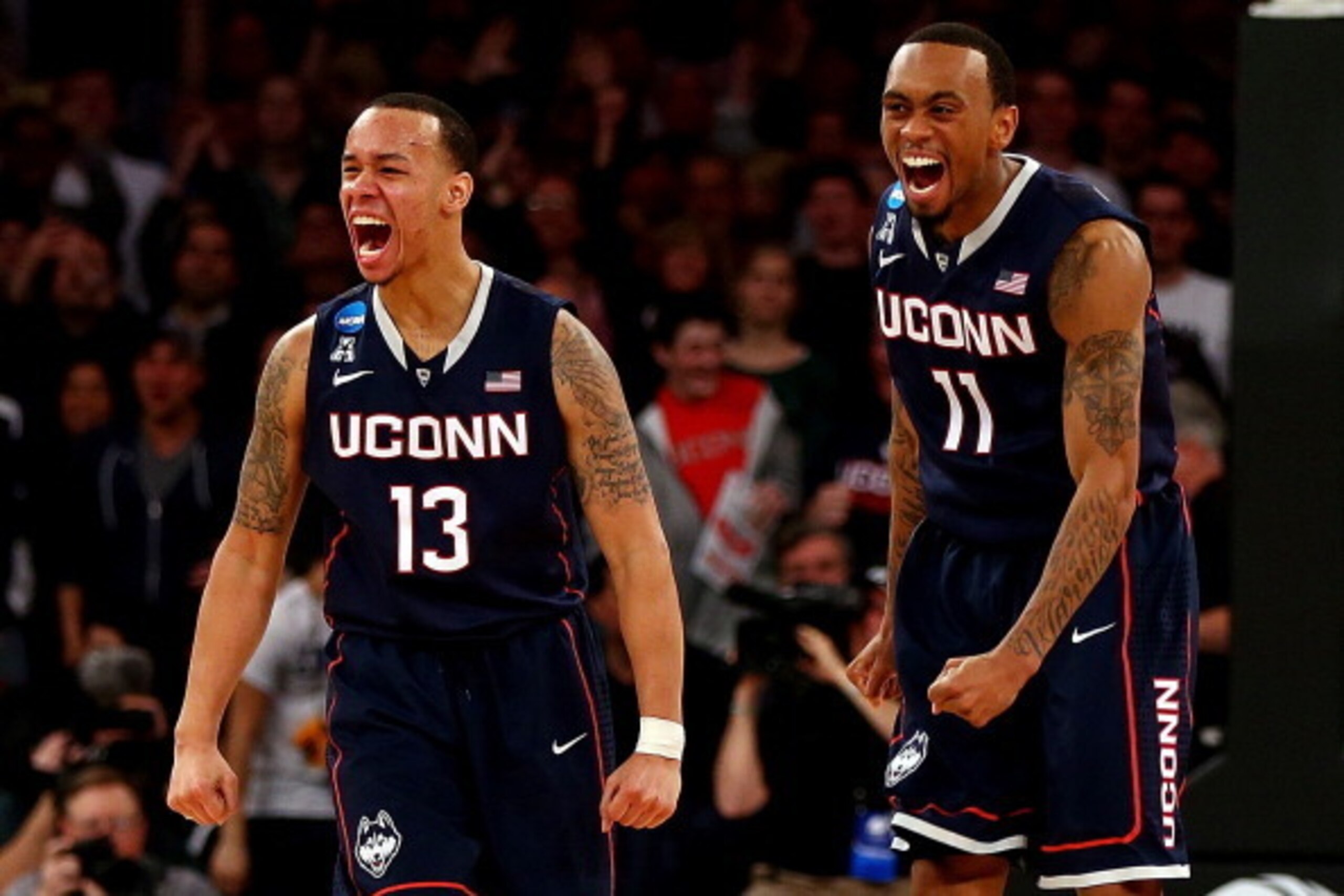 NEW YORK, NY - MARCH 30:  Shabazz Napier #13 and Ryan Boatright #11 of the Connecticut Huskies reacts after a play late in the game against the Michigan State Spartans during the East Regional Final of the 2014 NCAA Men's Basketball Tournament at Madison 