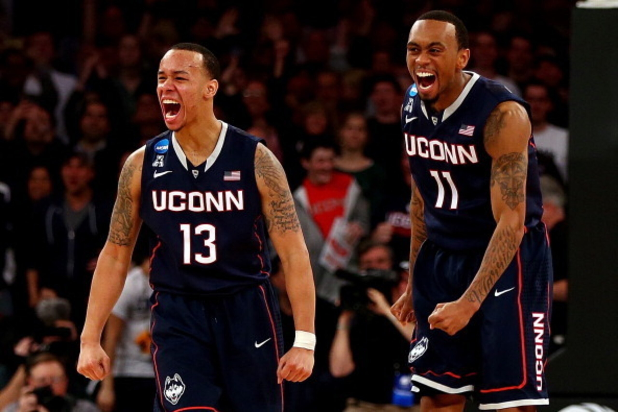 NEW YORK, NY - MARCH 30:  Shabazz Napier #13 and Ryan Boatright #11 of the Connecticut Huskies reacts after a play late in the game against the Michigan State Spartans during the East Regional Final of the 2014 NCAA Men's Basketball Tournament at Madison 