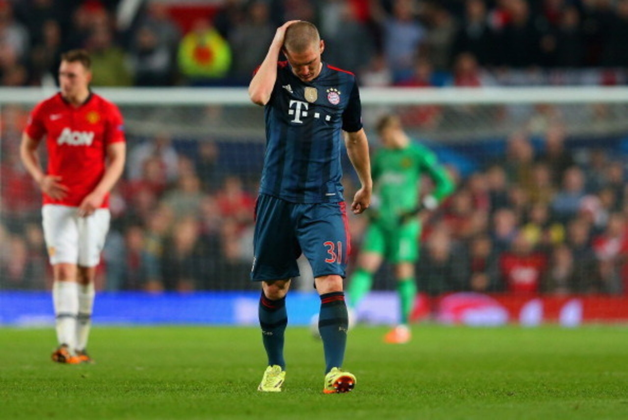 MANCHESTER, ENGLAND - APRIL 01:  A dejected Bastian Schweinsteiger of Bayern Muenchen holds his head after he was shown a red card during the UEFA Champions League Quarter Final first leg match between Manchester United and FC Bayern Muenchen at Old Traff