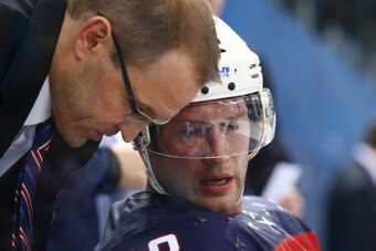SOCHI, RUSSIA - FEBRUARY 19:  head coach Dan Bylsma of the United States speaks with Blake Wheeler #28 of the United States during the Men's Ice Hockey Quarterfinal Playoff against the Czech Republic on Day 12 of the 2014 Sochi Winter Olympics at Shayba A