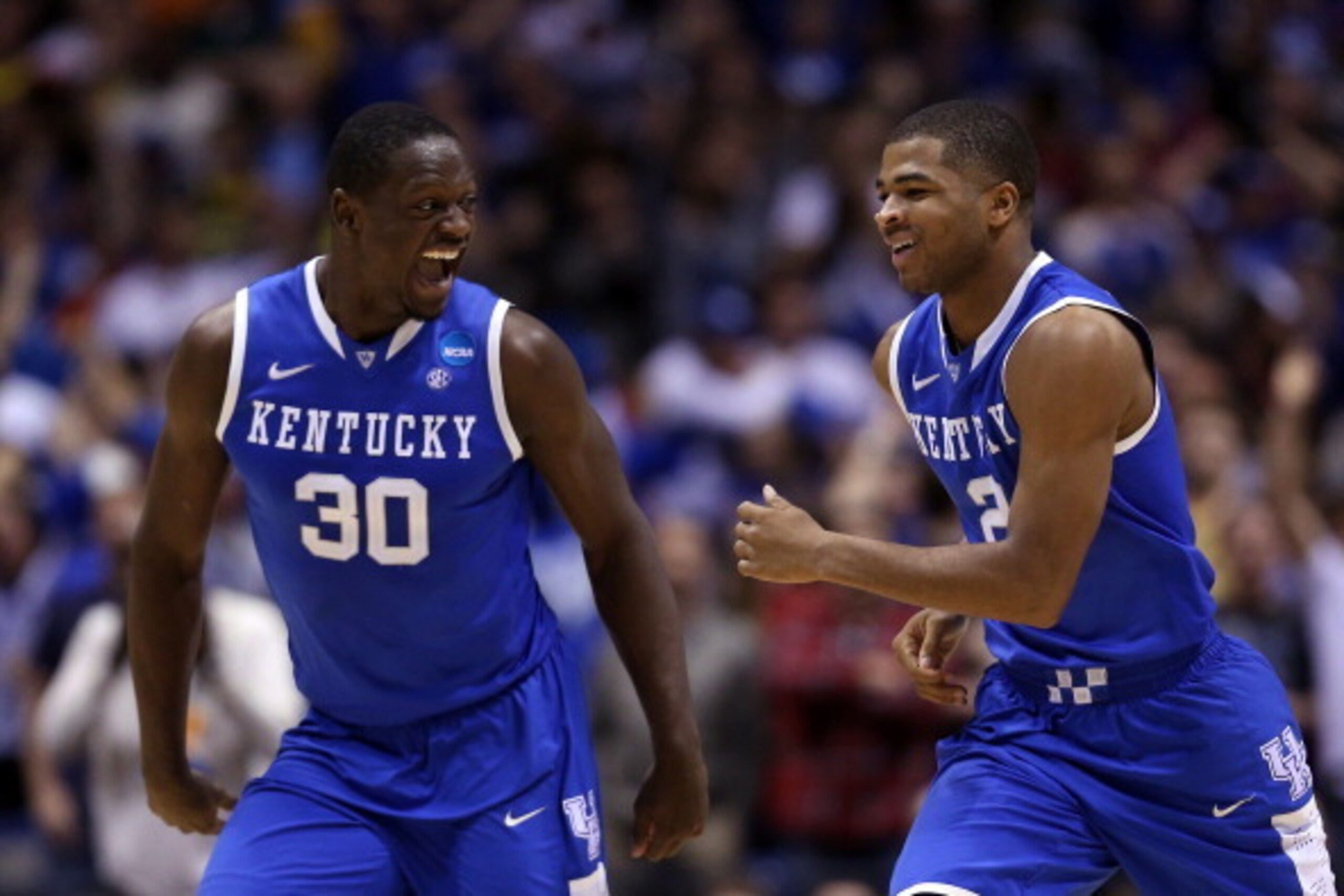 INDIANAPOLIS, IN - MARCH 30: Aaron Harrison #2 of the Kentucky Wildcats celebrates with teammate Julius Randle #30 after defeating the Michigan Wolverines 75 to 72 in the midwest regional final of the 2014 NCAA Men's Basketball Tournament at Lucas Oil St INDIANAPOLIS, IN - MARCH 30: Aaron Harrison #2 of the Kentucky Wildcats celebrates with teammate Julius Randle #30 after defeating the Michigan Wolverines 75 to 72 in the midwest regional final of the 2014 NCAA Men's Basketball Tournament at Lucas Oil St