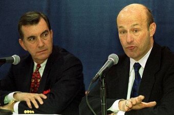 Braves president Stan Kasten (right, with GM John Schuerholz) addresses the media in January 2000, after Bud Selig suspended Rocker.