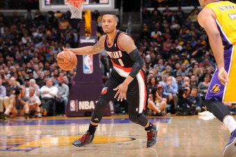 LOS ANGELES, CA - APRIL 1: Damian Lillard #0 of the Portland Trail Blazers dribbles up the court against the Los Angeles Lakers at Staples Center on April 1, 2014 in Los Angeles, California. NOTE TO USER: User expressly acknowledges and agrees that, by do