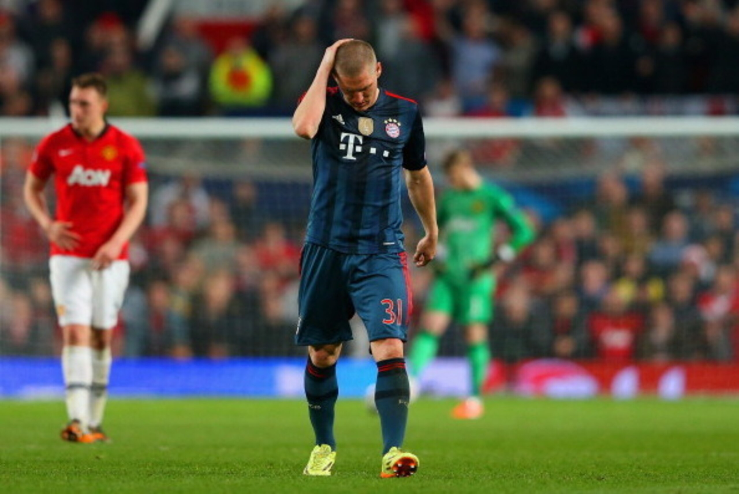 MANCHESTER, ENGLAND - APRIL 01:  A dejected Bastian Schweinsteiger of Bayern Muenchen holds his head after he was shown a red card during the UEFA Champions League Quarter Final first leg match between Manchester United and FC Bayern Muenchen at Old Traff