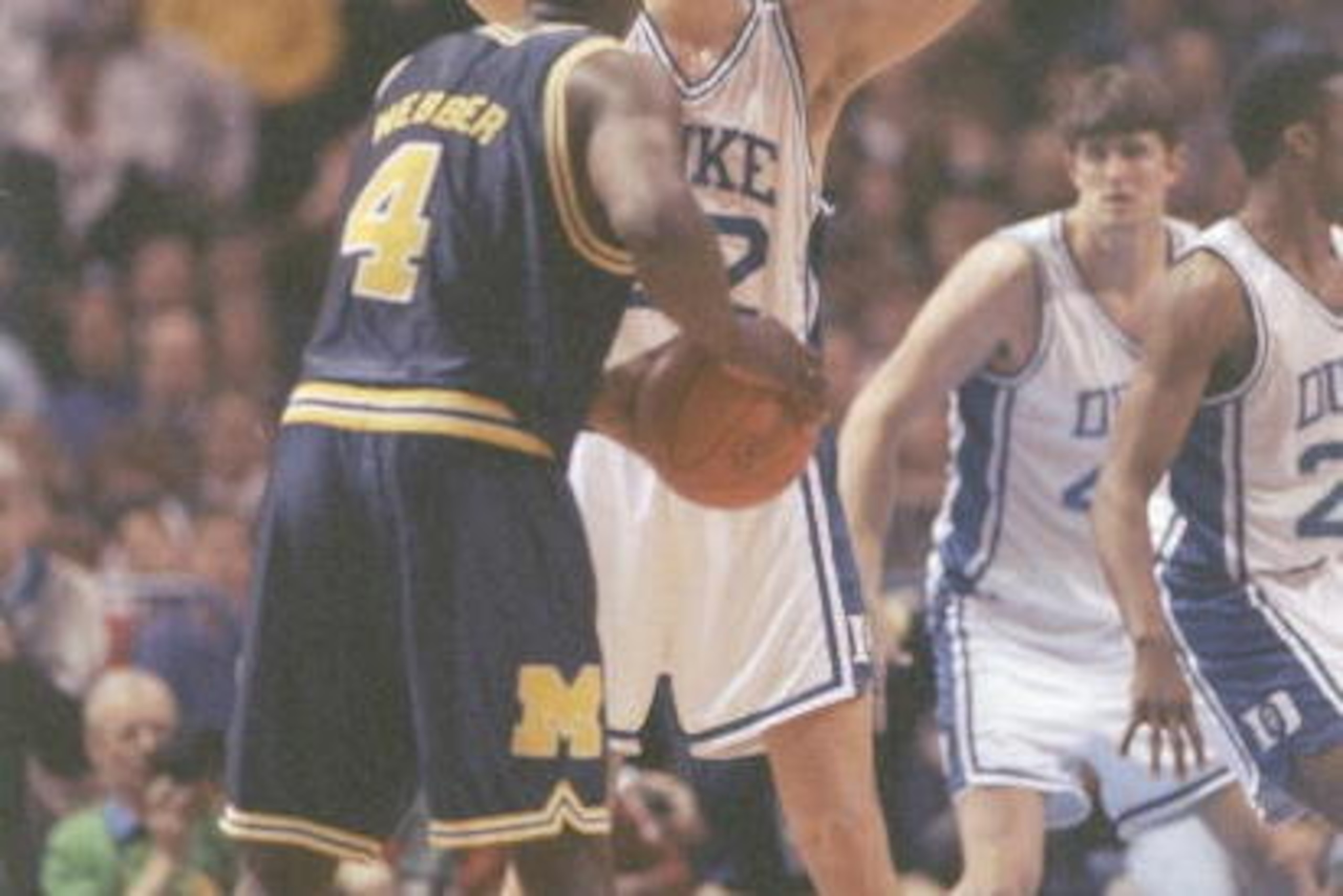 6 Apr 1992:  Forward Chris Webber of the Michigan Wolverines tries to fend off center Christian Laettner of the Duke Blue Devils during a playoff game at the Hubert H. Humphrey Metrodome in Minneapolis, Minnesota.  Duke won the game 71-51. Mandatory Credi