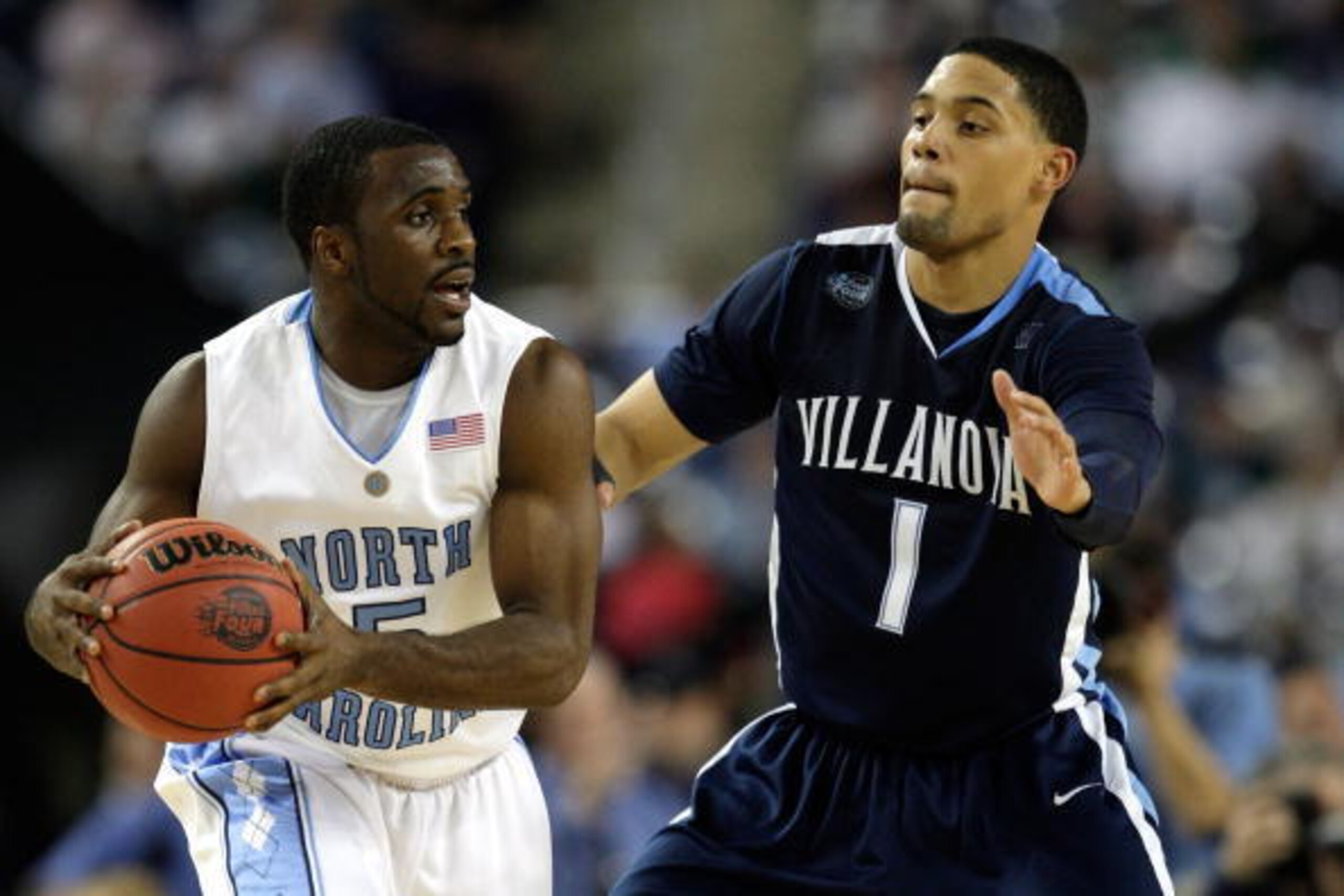 DETROIT - APRIL 04:  Ty Lawson #5 of the North Carolina Tar Heels looks to pass the ball against Scottie  Reynolds #1 of the Villanova Wildcats during the National Semifinal game of the NCAA Division I Men's Basketball Championship at Ford Field on April 