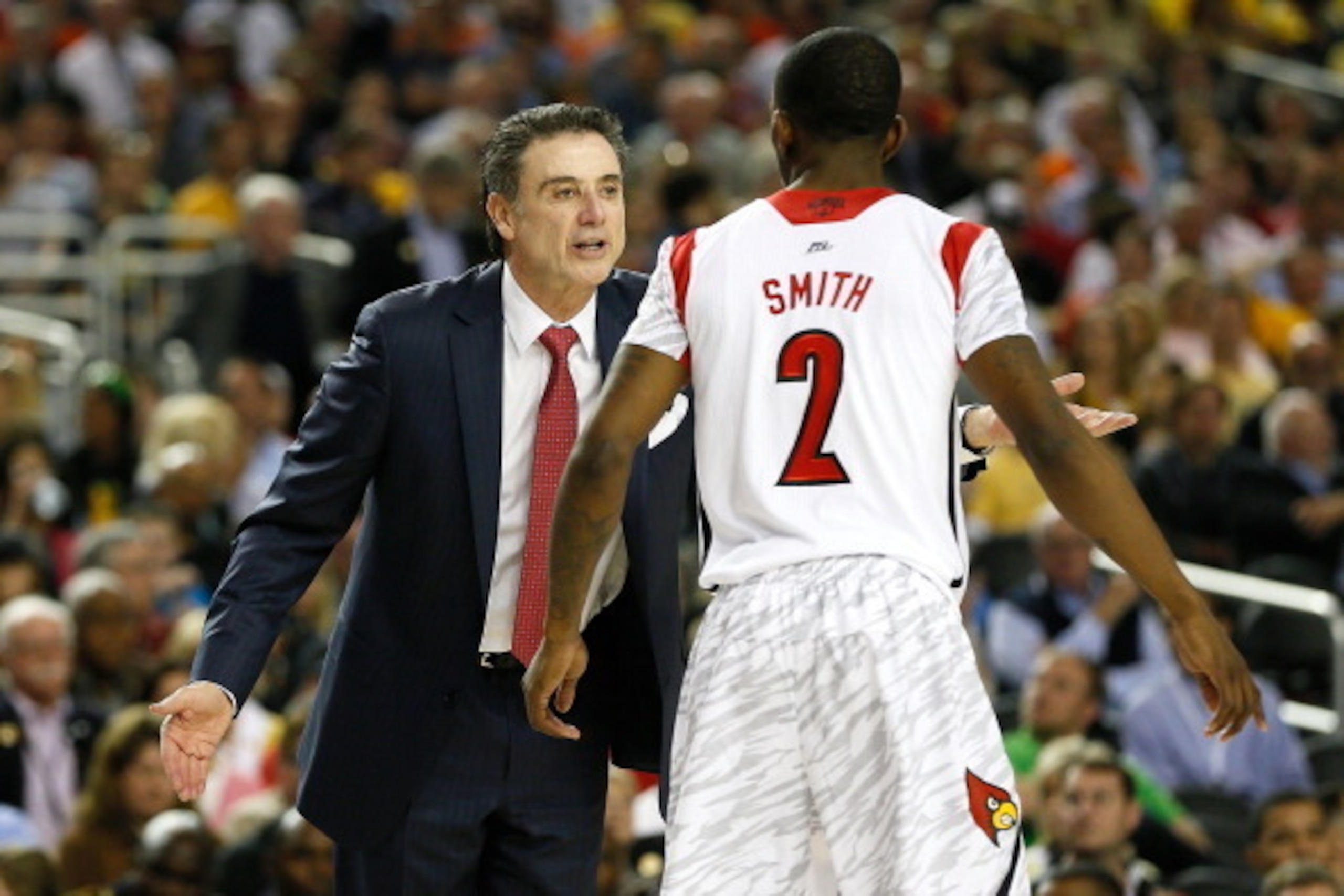 ATLANTA, GA - APRIL 06:  Head coach Rick Pitino of the Louisville Cardinals talks with Russ Smith #2 in the second half against the Wichita State Shockers during the 2013 NCAA Men's Final Four Semifinal at the Georgia Dome on April 6, 2013 in Atlanta, Geo
