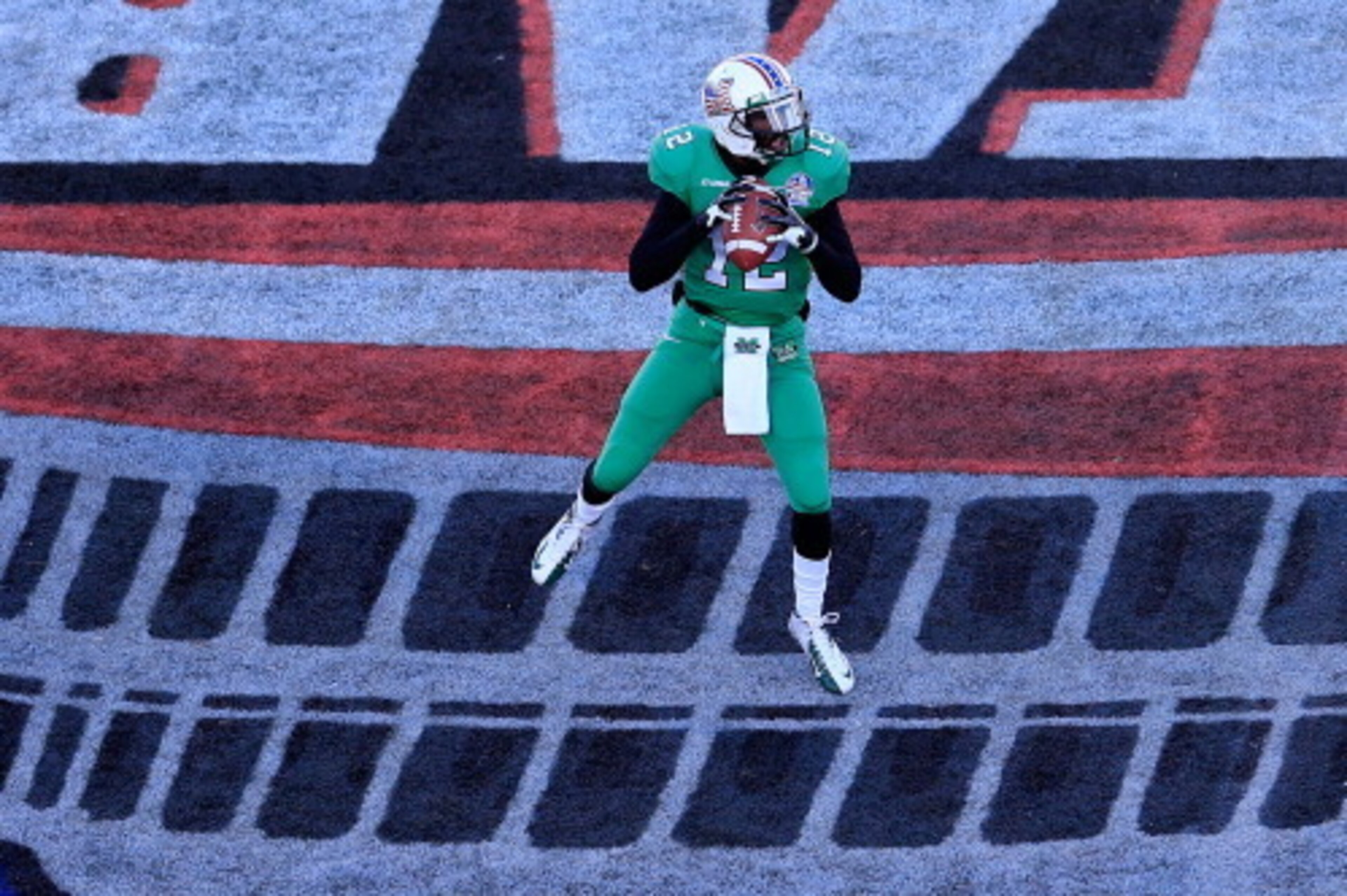 ANNAPOLIS, MD - DECEMBER 27: Quarterback Rakeem Cato #12 of the Marshall Thundering Herd drops back to pass against the Maryland Terrapins during the first half of the 2013 Military Bowl at Navy Marine Corps Memorial Stadium on December 27, 2013 in Annapo