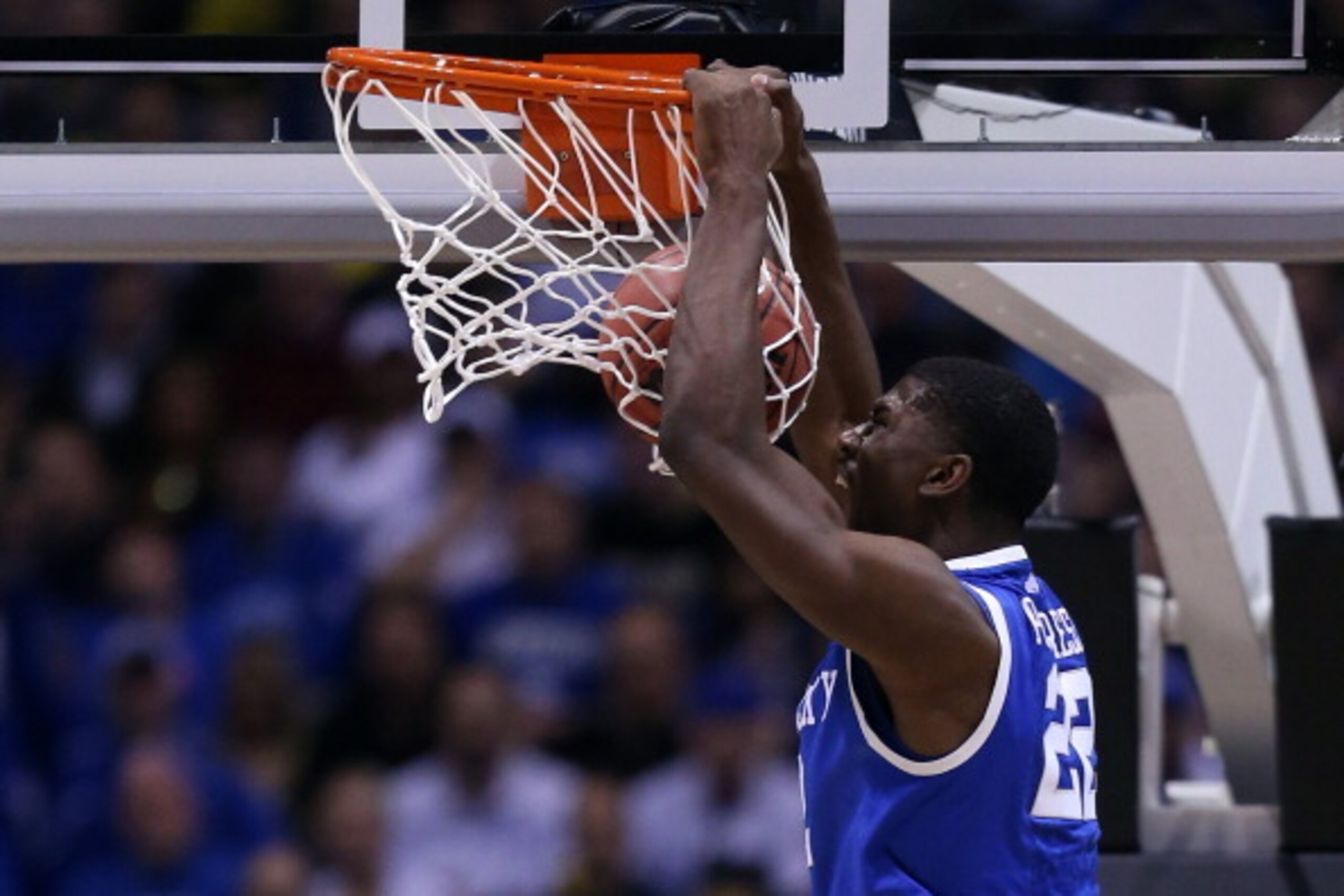 INDIANAPOLIS, IN - MARCH 30: Alex Poythress #22 of the Kentucky Wildcats dunks the ball over Caris LeVert #23 of the Michigan Wolverines in the first half during the midwest regional final of the 2014 NCAA Men's Basketball Tournament at Lucas Oil Stadium INDIANAPOLIS, IN - MARCH 30: Alex Poythress #22 of the Kentucky Wildcats dunks the ball over Caris LeVert #23 of the Michigan Wolverines in the first half during the midwest regional final of the 2014 NCAA Men's Basketball Tournament at Lucas Oil Stadium