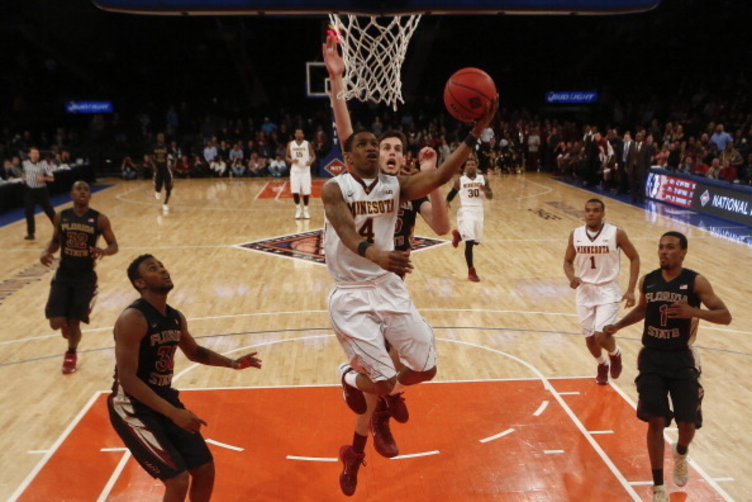NEW YORK, NY - APRIL 1: Deandre Mathieu #4 of the Minnesota Golden Gophers drives by Boris Bojanovsky #15 of the Florida State Seminoles during the NIT Championship semifinals at Madison Square Garden on April 1, 2014 in New York City. (Photo by Jeff Ze NEW YORK, NY - APRIL 1: Deandre Mathieu #4 of the Minnesota Golden Gophers drives by Boris Bojanovsky #15 of the Florida State Seminoles during the NIT Championship semifinals at Madison Square Garden on April 1, 2014 in New York City. (Photo by Jeff Ze