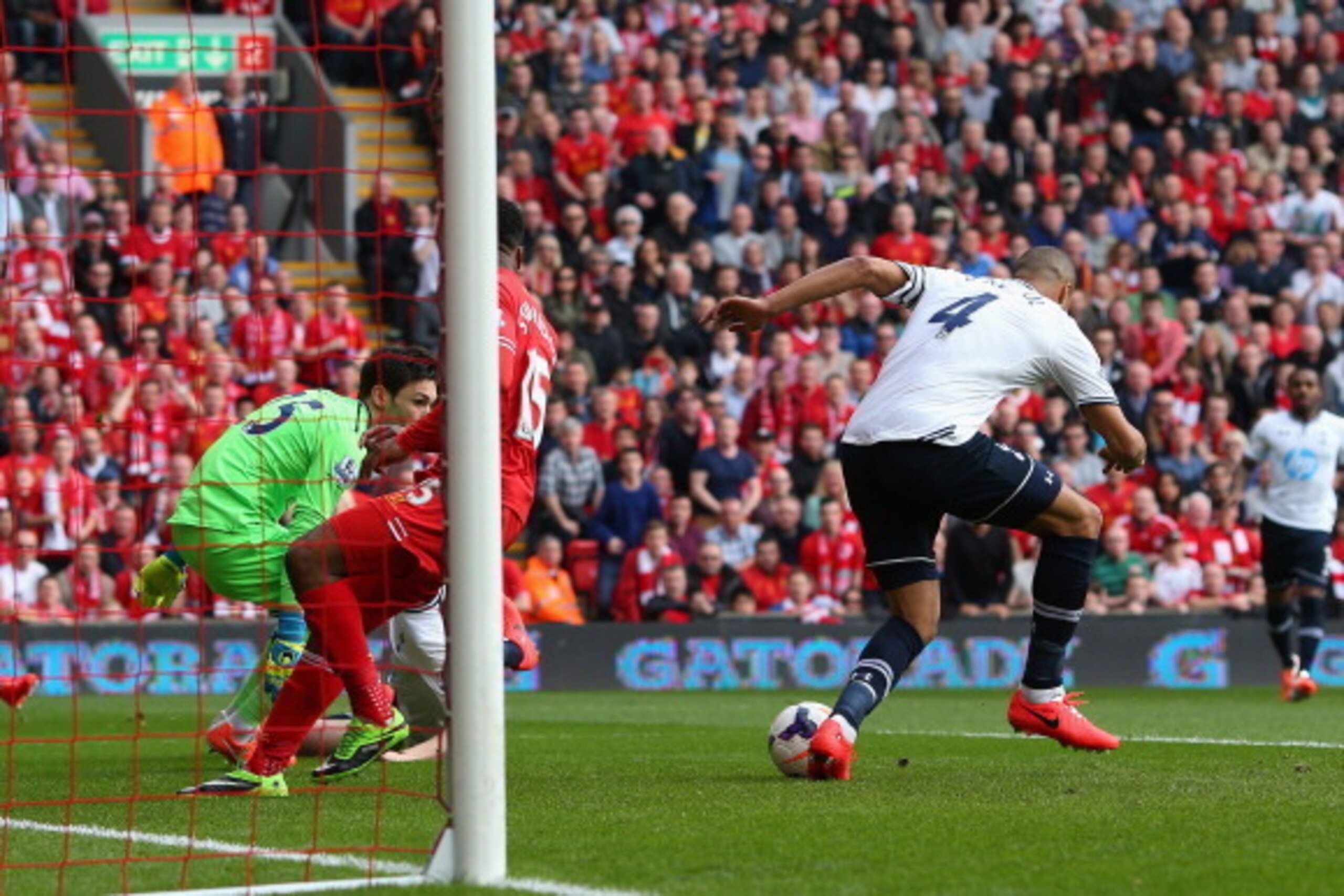 LIVERPOOL, ENGLAND - MARCH 30:  Younes Kaboul of Tottenham Hotspur scores an own goal during the Barclays Premier League match between Liverpool and Tottenham Hotspur at Anfield on March 30, 2014 in Liverpool, England.  (Photo by Alex Livesey/Getty Images