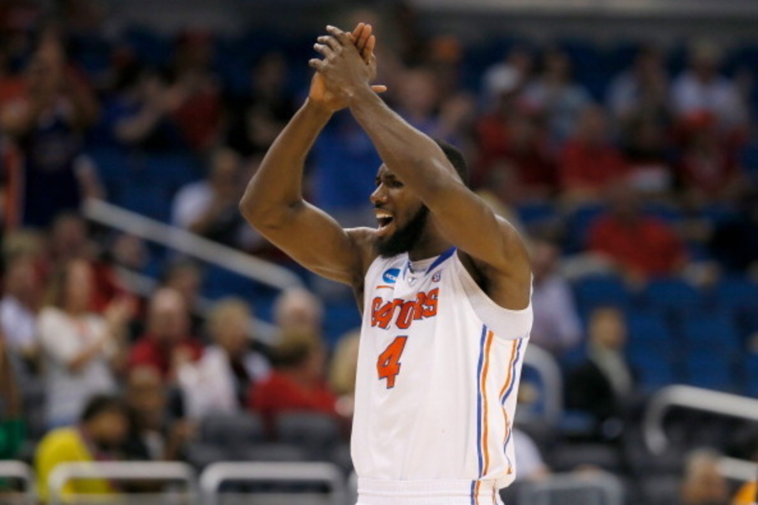 ORLANDO, FL - MARCH 22:  Patric Young #4 of the Florida Gators celebrates in the first half while taking on the Pittsburgh Panthers during the third round of the 2014 NCAA Men's Basketball Tournament at Amway Center on March 22, 2014 in Orlando, Florida. 