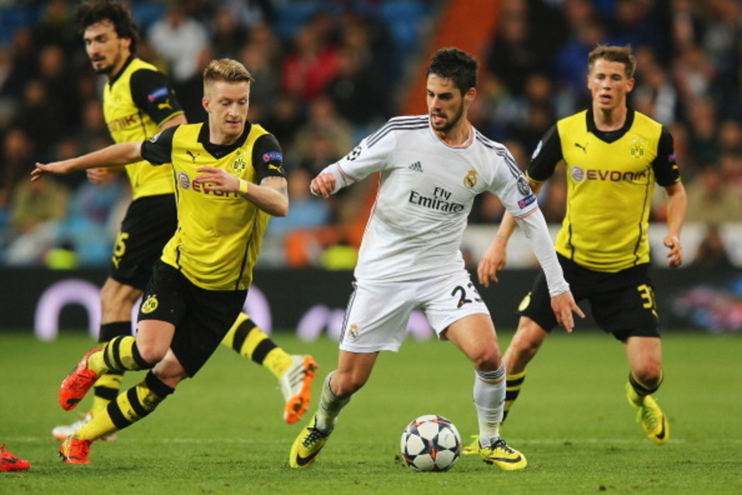 MADRID, SPAIN - APRIL 02:  Isco of Real Madrid is closed down by Marco Reus (L) of Borussia Dortmund during the UEFA Champions League Quarter Final first leg match between Real Madrid and Borussia Dortmund at Estadio Santiago Bernabeu on April 2, 2014 in 