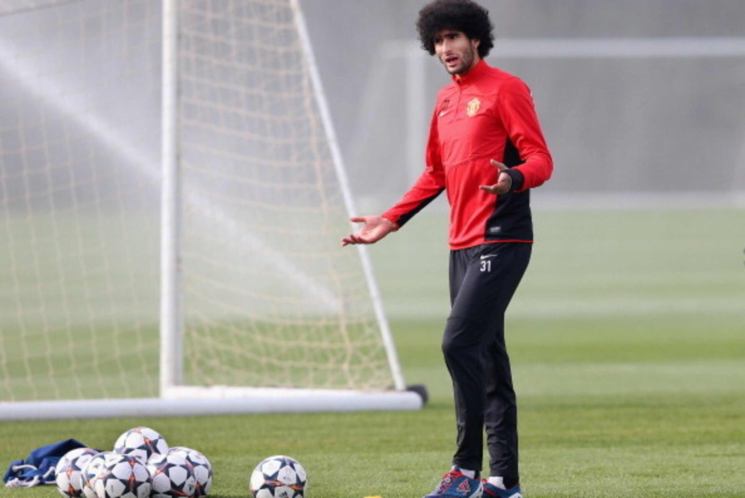 MANCHESTER, ENGLAND - MARCH 31:  Marouane Fellaini of Manchester United looks on during a training session at the Aon Training Complex on March 31, 2014 in Manchester, England.  (Photo by Alex Livesey/Getty Images)