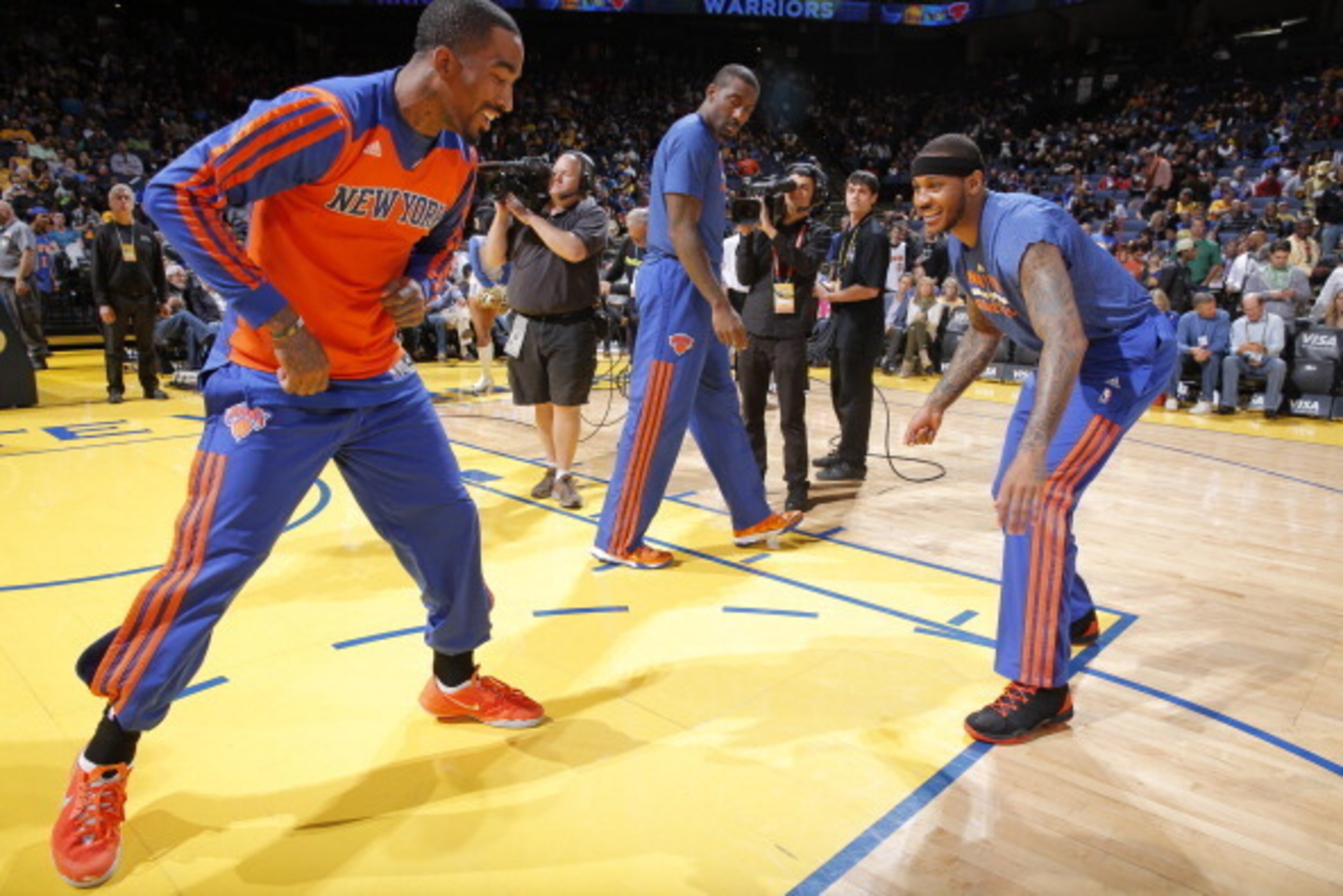 OAKLAND, CA - MARCH 30: J.R. Smith #8 and Carmelo Anthony #7 of the New York Knicks prior to the game against the Golden State Warriors on March 30, 2014 at Oracle Arena in Oakland, California. NOTE TO USER: User expressly acknowledges and agrees that, by