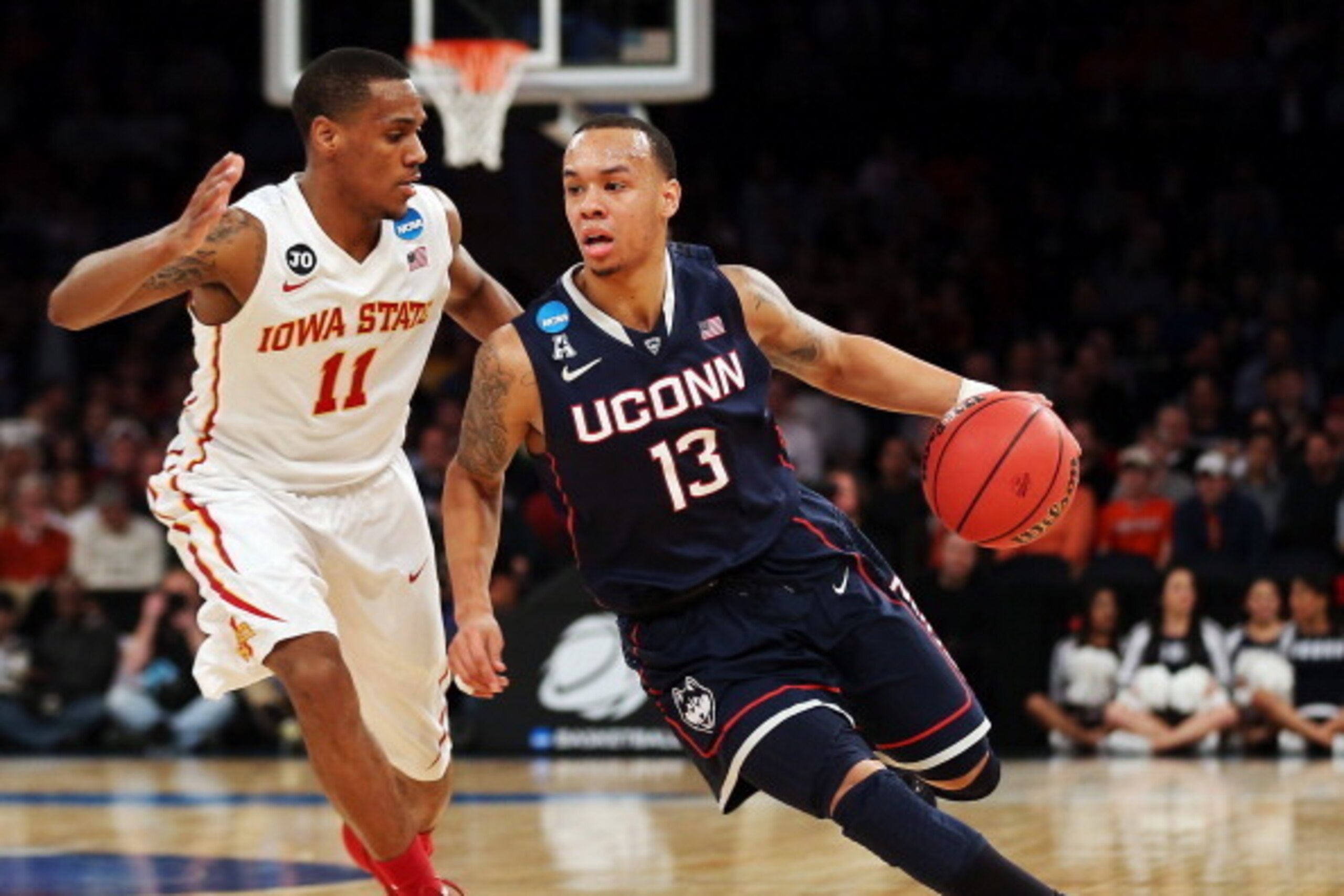 NEW YORK, NY - MARCH 28:  Shabazz Napier #13 of the Connecticut Huskies handles the ball against Monte Morris #11 of the Iowa State Cyclones during the regional semifinal of the 2014 NCAA Men's Basketball Tournament at Madison Square Garden on March 28, 2