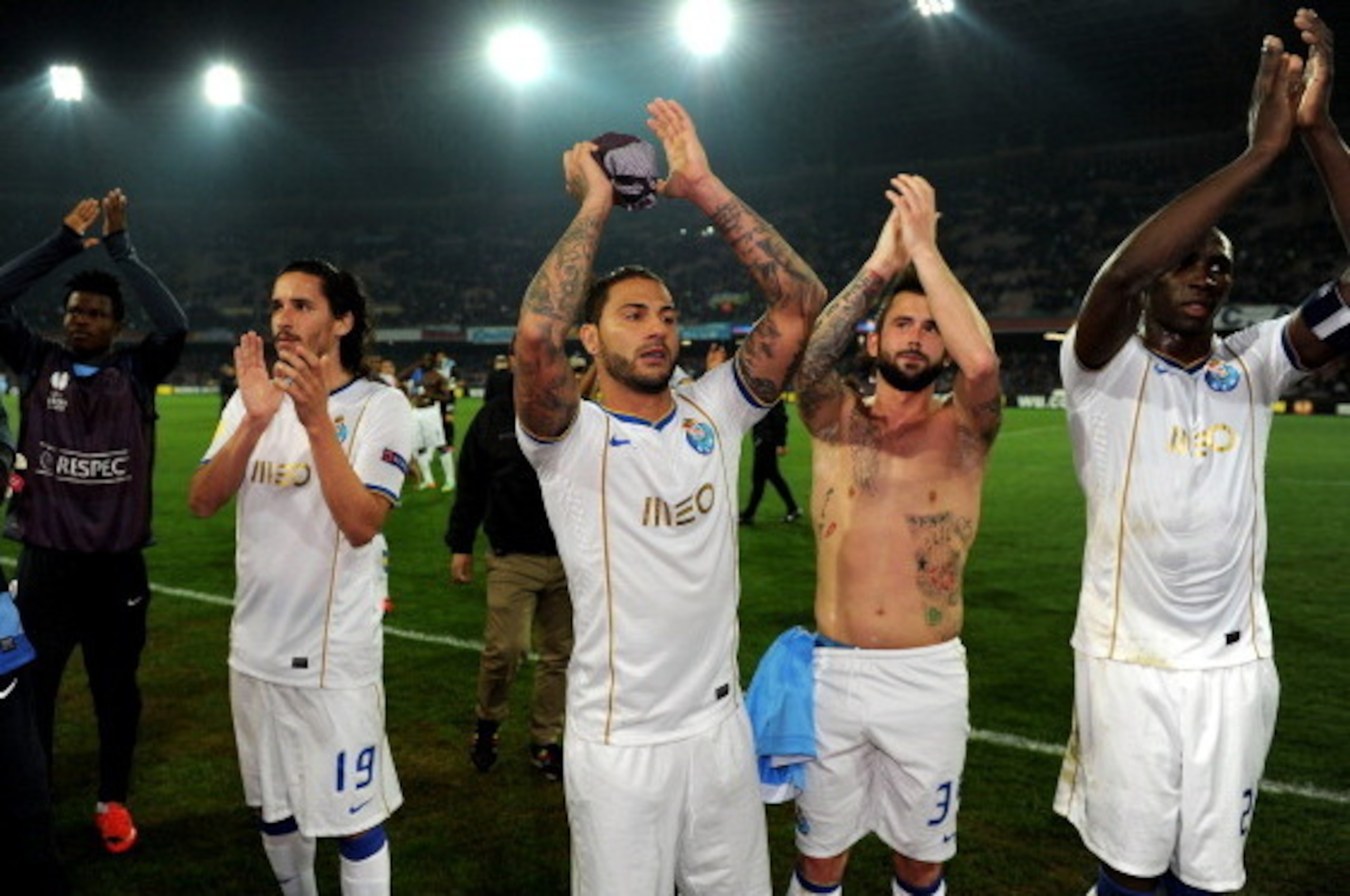 NAPLES, ITALY - MARCH 20:  Players of FC Porto celebrate victory after the UEFA Europa League Round of 16 match between SSC Napoli and FC Porto at Stadio San Paolo on March 20, 2014 in Naples, Italy.  (Photo by Giuseppe Bellini/Getty Images)