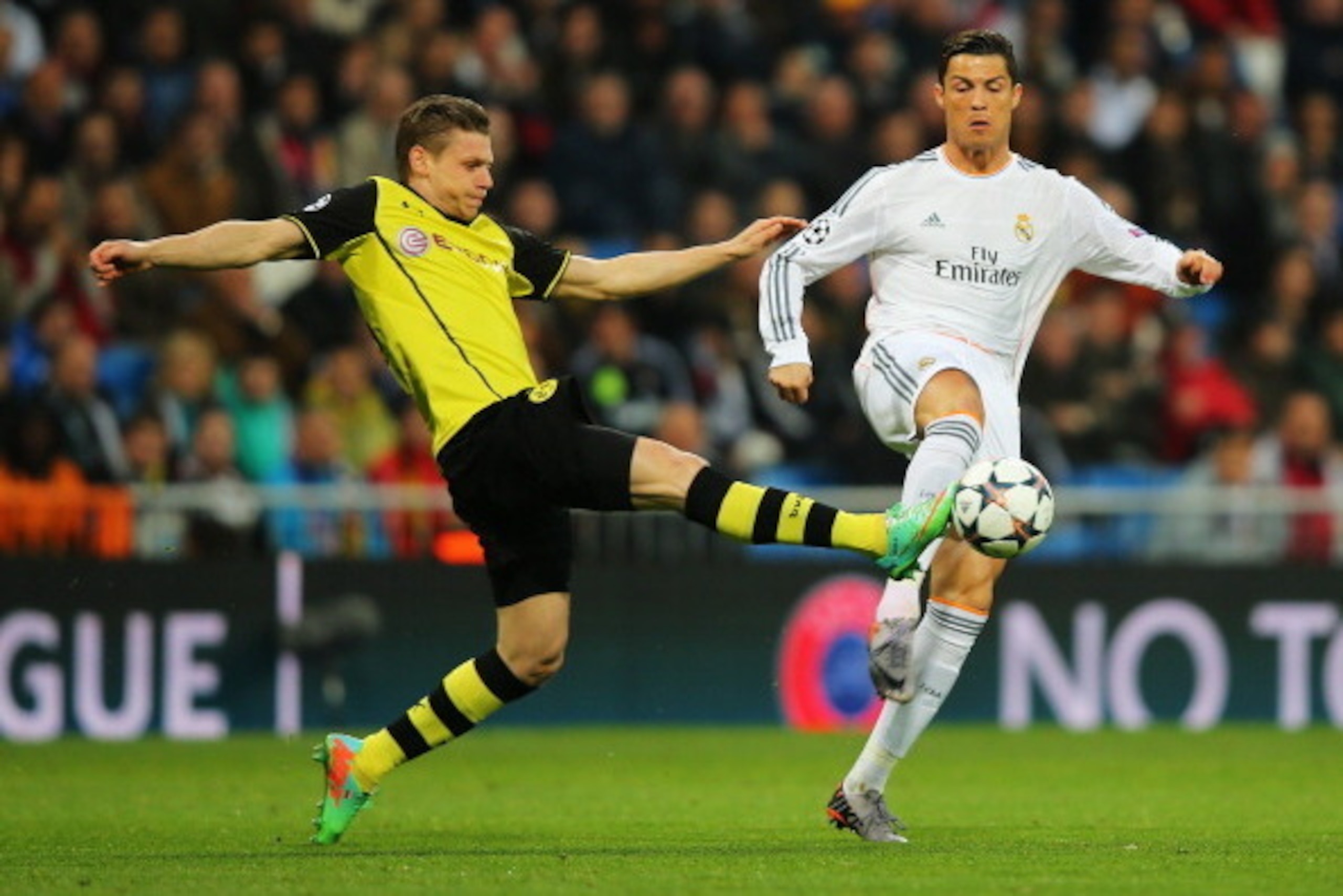 MADRID, SPAIN - APRIL 02: Cristiano Ronaldo of Real Madrid is tackled by Lukasz Piszczek of Borussia Dortmund during the UEFA Champions League Quarter Final first leg match between Real Madrid and Borussia Dortmund at Estadio Santiago Bernabeu on April 2 MADRID, SPAIN - APRIL 02: Cristiano Ronaldo of Real Madrid is tackled by Lukasz Piszczek of Borussia Dortmund during the UEFA Champions League Quarter Final first leg match between Real Madrid and Borussia Dortmund at Estadio Santiago Bernabeu on April 2