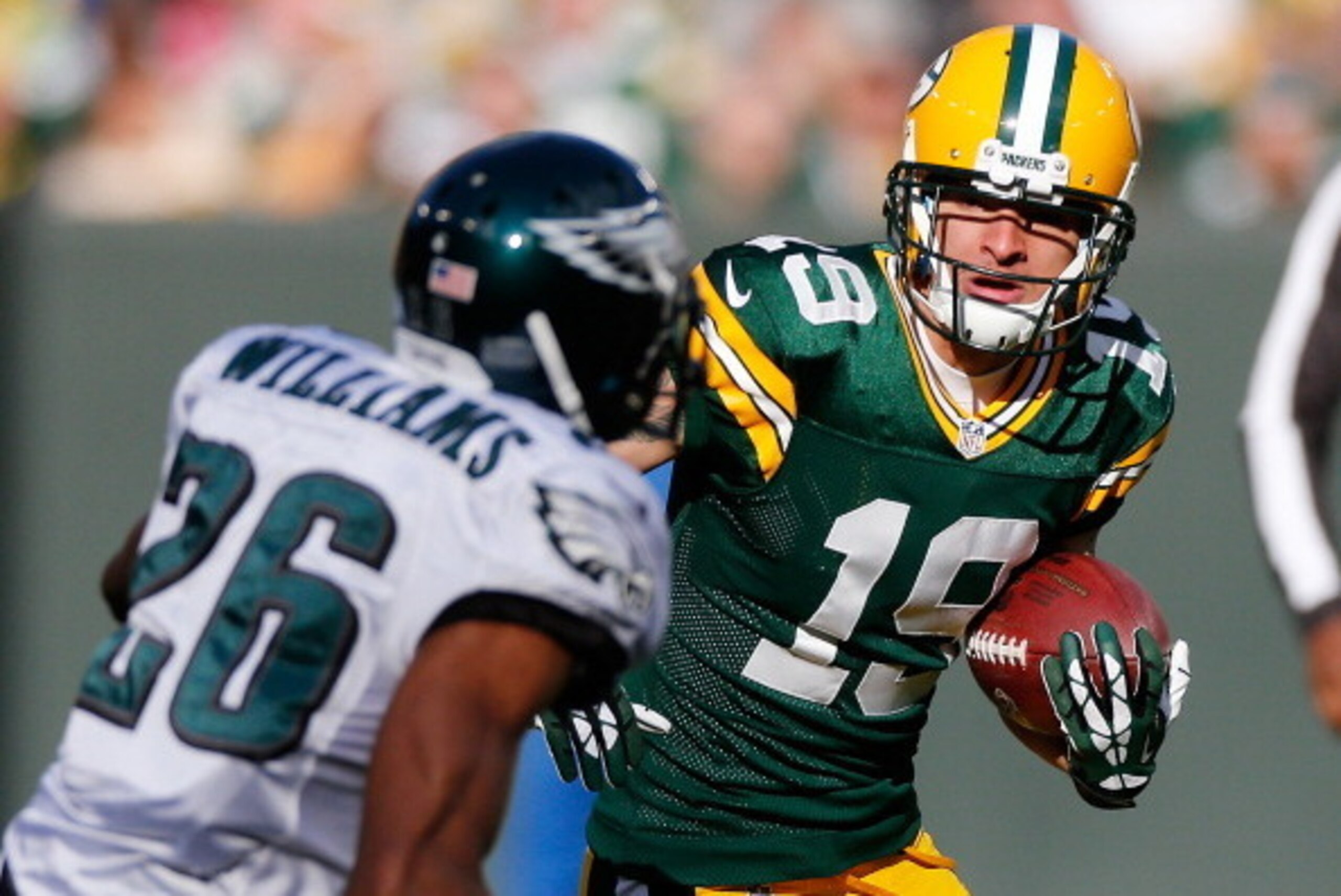 GREEN BAY, WI - NOVEMBER 10: Myles White #19 of the Green Bay Packers looks for extra yards after a second quarter catch behind Cary Williams #26 of the Philadelphia Eagles at Lambeau Field on November 10, 2013 in Green Bay, Wisconsin. (Photo by Gregory S