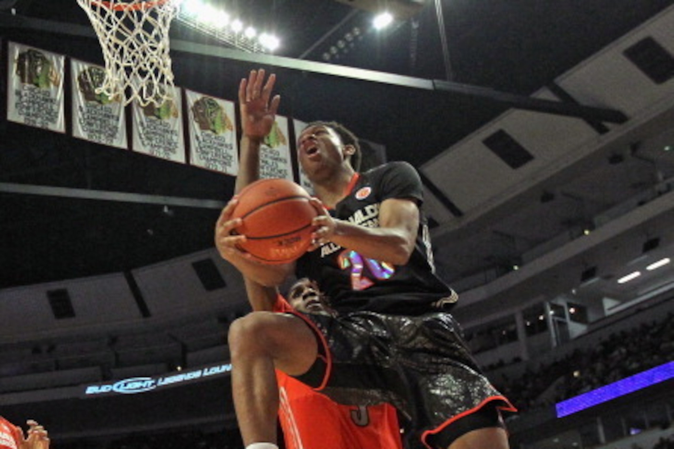 CHICAGO, IL - APRIL 2: Rashad Vaughn #20 of the west team goes up for a shot over Kevon Looney #5 of the east team during the 2014 McDonald's All American Game at United Center on April 2, 2014 in Chicago, Illinois. (Photo by Jonathan Daniel/Getty Images)