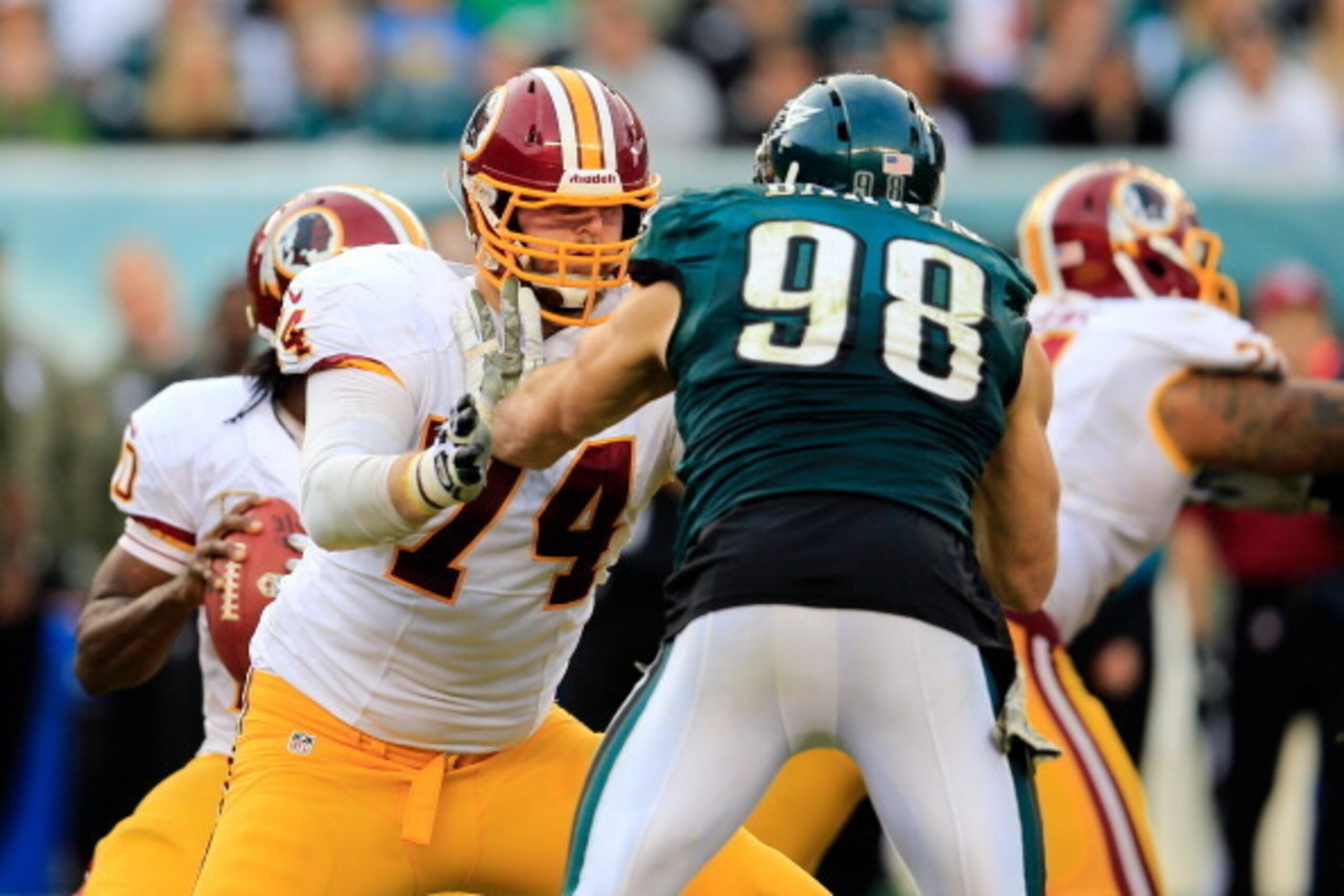 PHILADELPHIA, PA - NOVEMBER 17: Tackle Tyler Polumbus #74 of the Washington Redskins blocks outside linebacker Connor Barwin #98 of the Philadelphia Eagles at Lincoln Financial Field on November 17, 2013 in Philadelphia, Pennsylvania.  (Photo by Rob Carr/