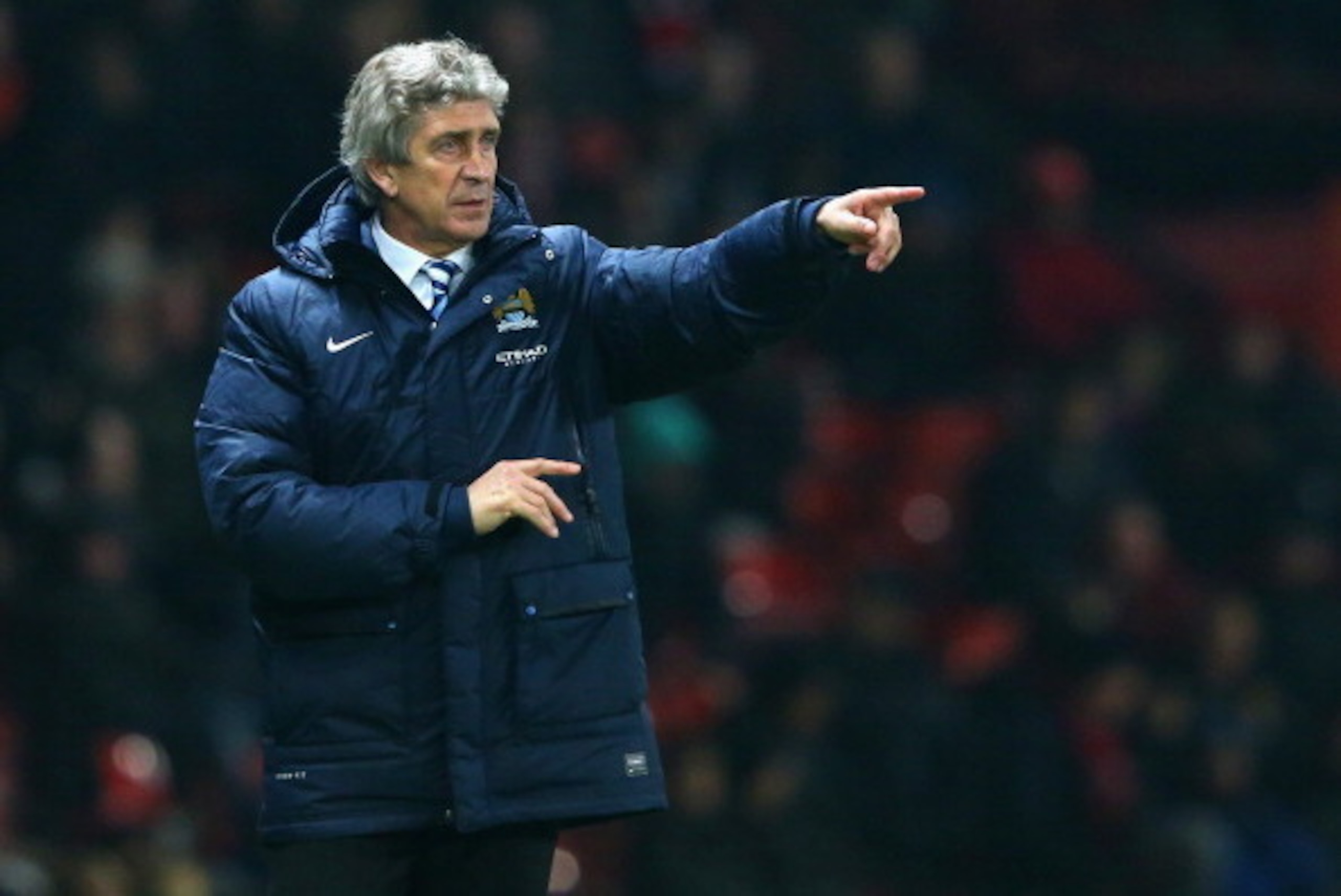 MANCHESTER, ENGLAND - MARCH 25:  Manchester City Manager Manuel Pellegrini gestures during the Barclays Premier League match between Manchester United and Manchester City at Old Trafford on March 25, 2014 in Manchester, England.  (Photo by Alex Livesey/Ge