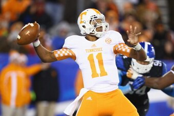 LEXINGTON, KY - NOVEMBER 30:  Joshua Dobbs #11 of the Tennessee Volunteers throws a pass during the game against the Kentucky Wildcats at Commonwealth Stadium on November 30, 2013 in Lexington, Kentucky.  (Photo by Andy Lyons/Getty Images)