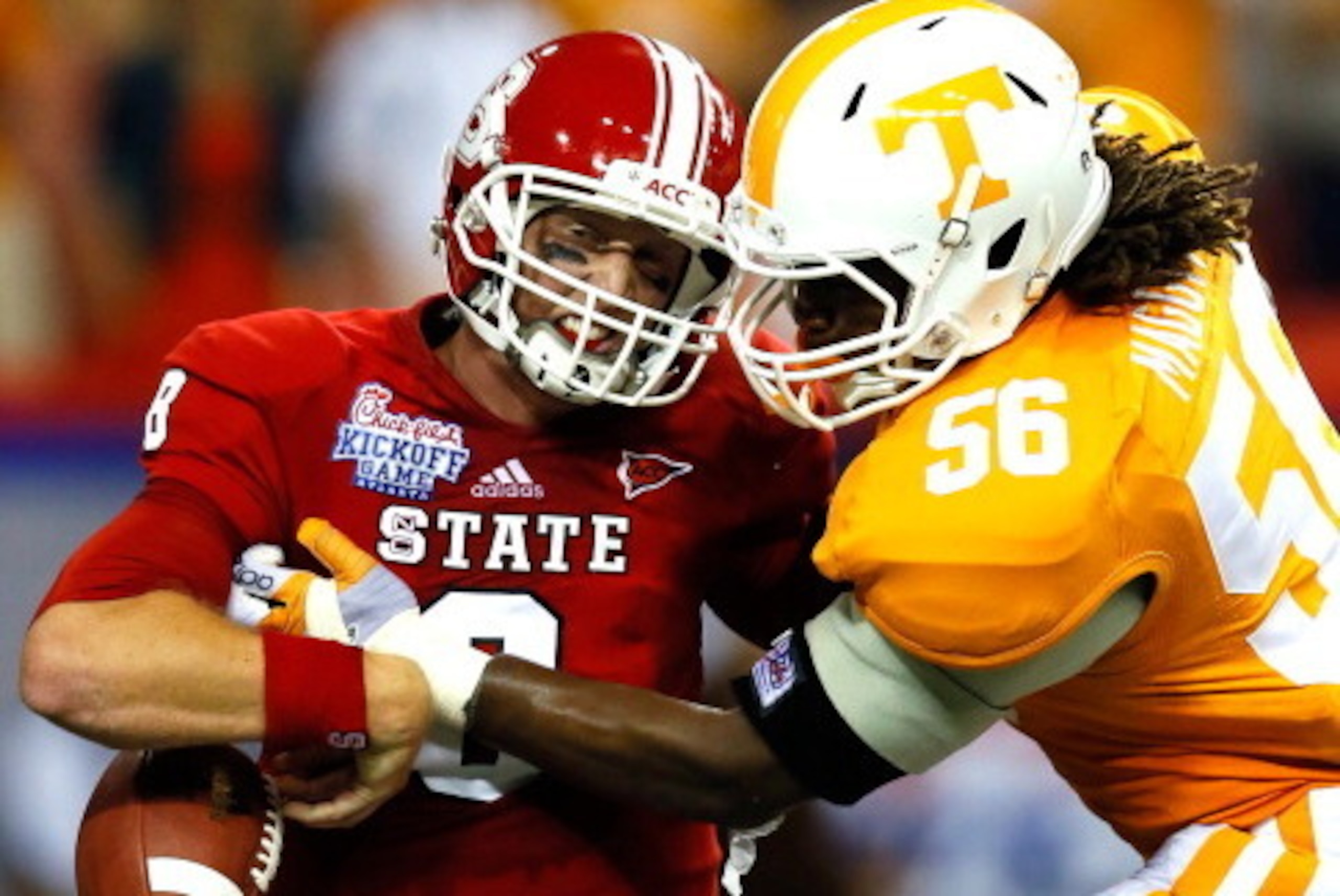 ATLANTA, GA - AUGUST 31:  Curt Maggitt #56 of the Tennessee Volunteers strips the ball from Mike Glennon #8 of the North Carolina State Wolfpack at Georgia Dome on August 31, 2012 in Atlanta, Georgia.  (Photo by Kevin C. Cox/Getty Images)