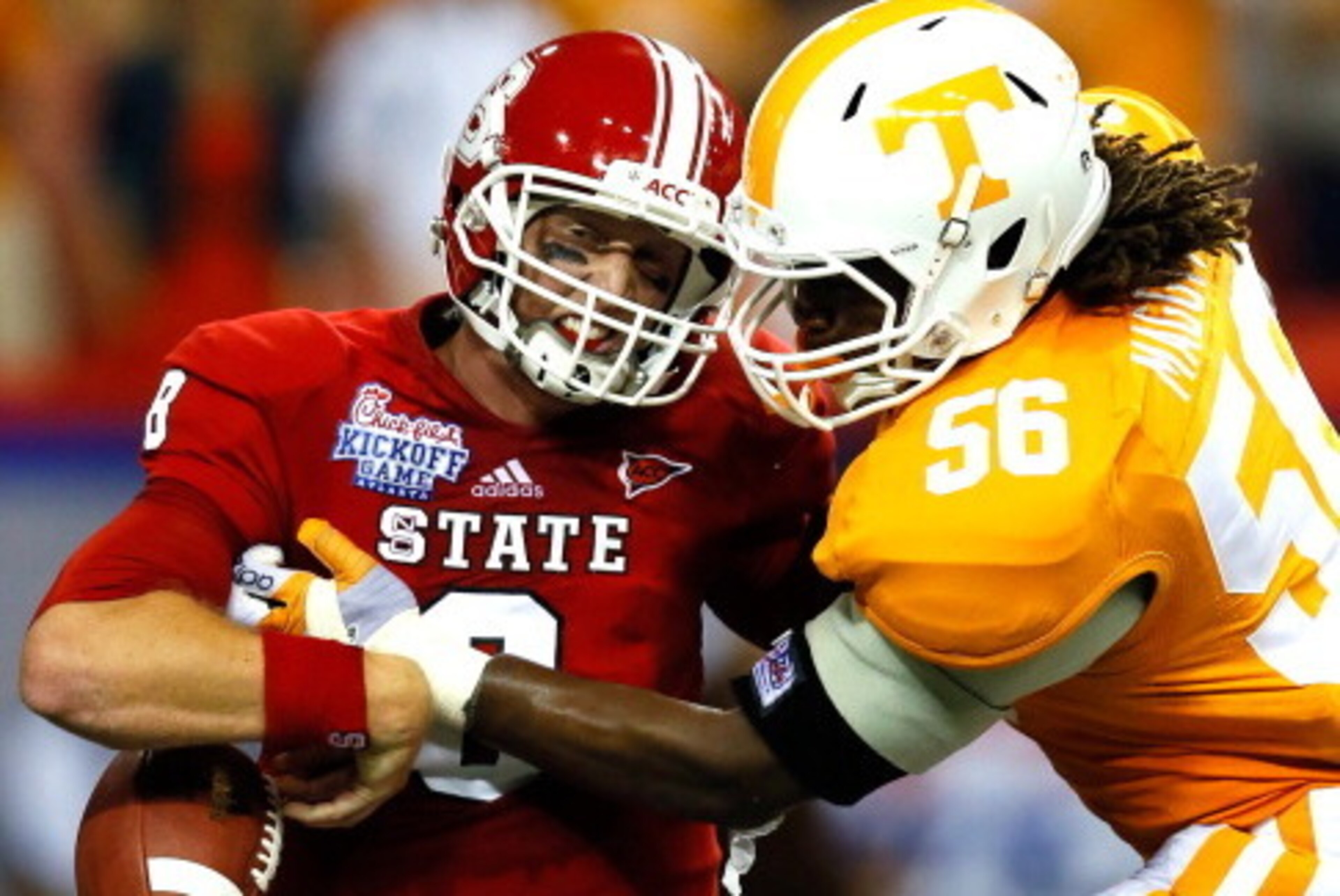 ATLANTA, GA - AUGUST 31:  Curt Maggitt #56 of the Tennessee Volunteers strips the ball from Mike Glennon #8 of the North Carolina State Wolfpack at Georgia Dome on August 31, 2012 in Atlanta, Georgia.  (Photo by Kevin C. Cox/Getty Images)